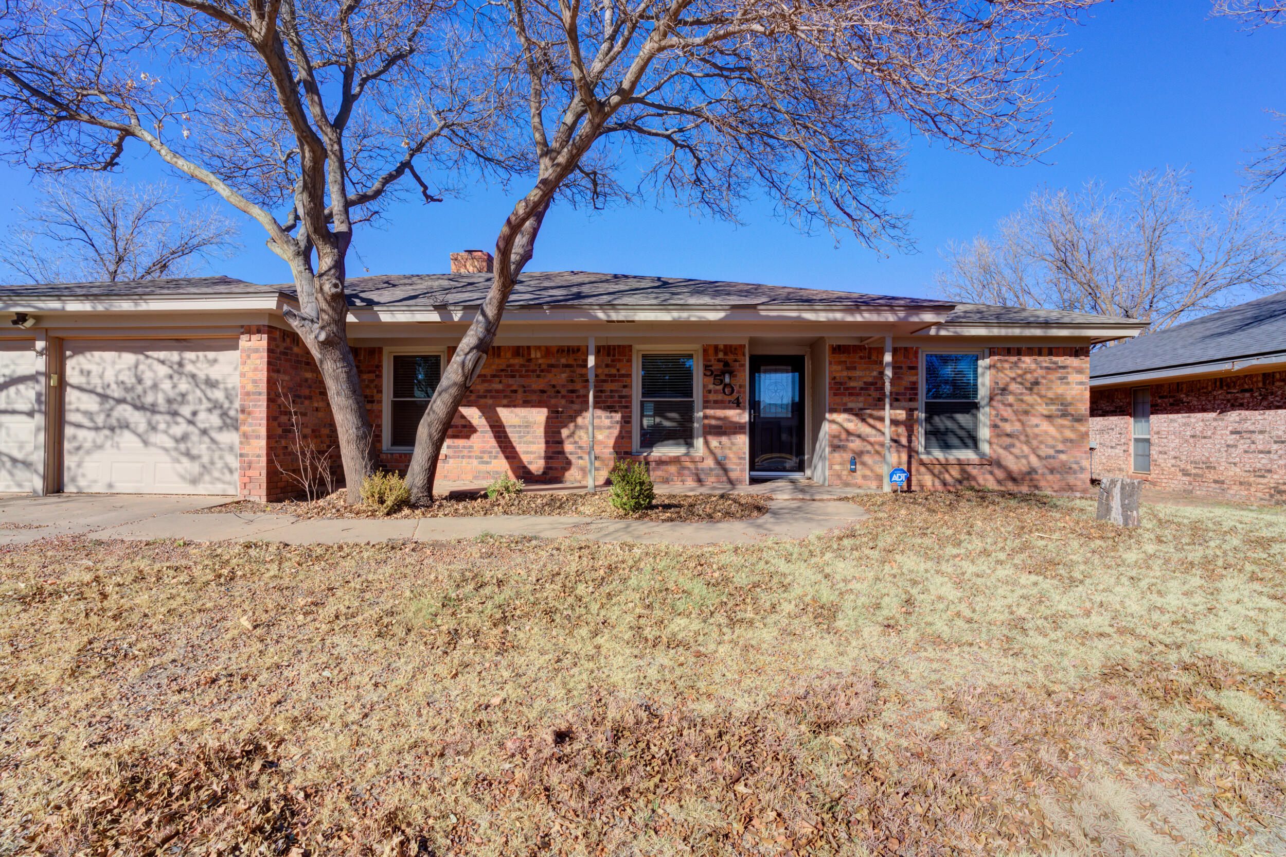 5504 73rd Street Lubbock, TX 79424 - Photo 2 of 39 a view of a house with backyard