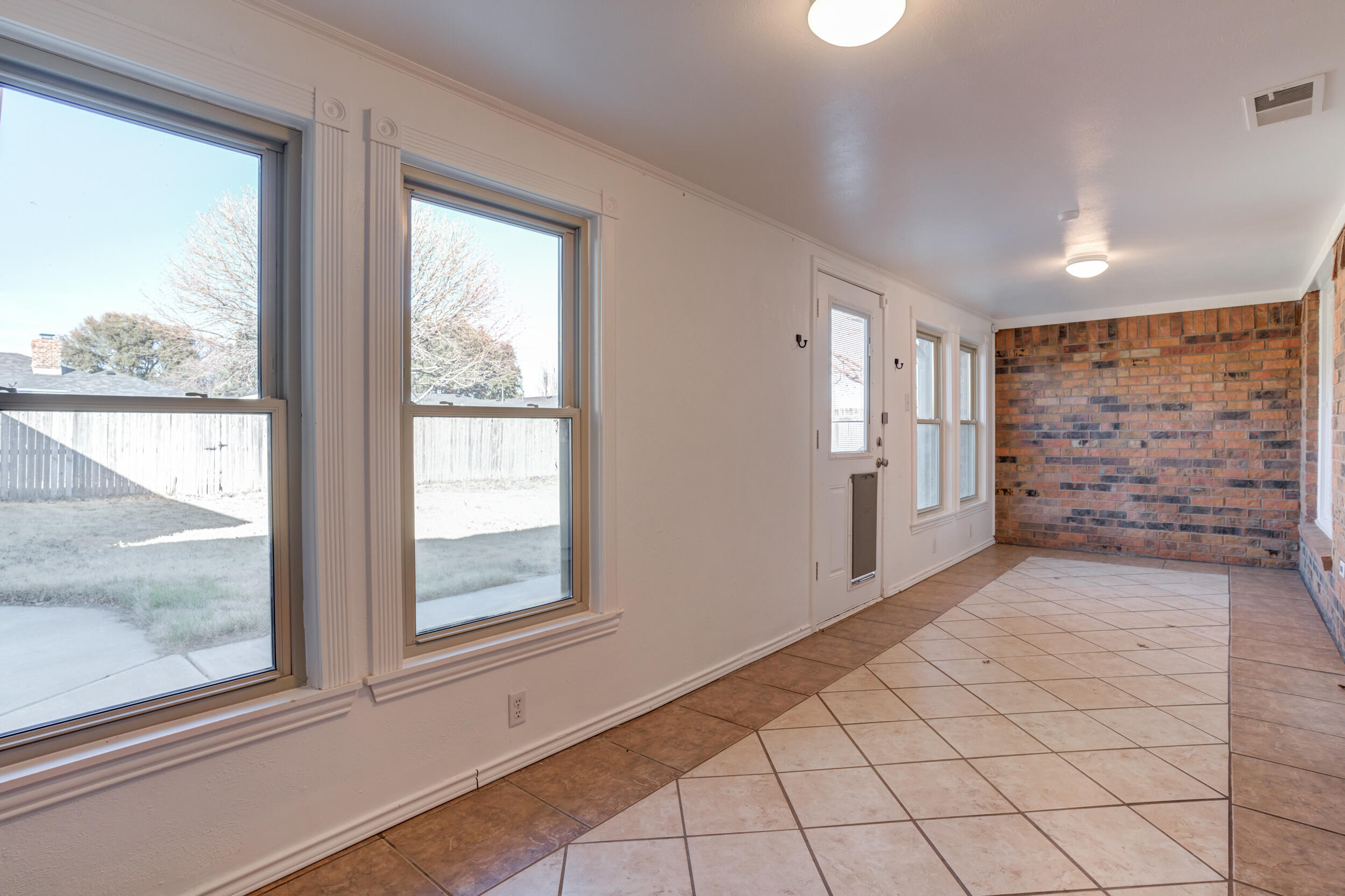 5504 73rd Street Lubbock, TX 79424 - Photo 23 of 39 a view of empty room with windows