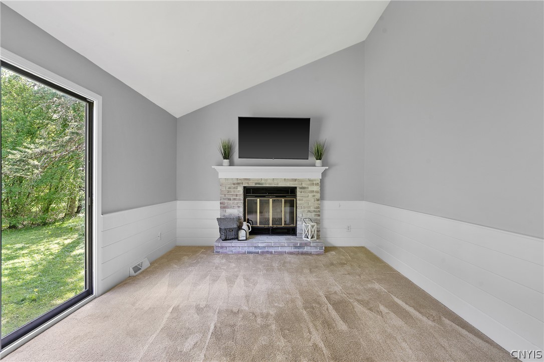 8841 Wandering Way Lysander, NY 13027 - Photo 21 of 42 Accented by a stylish shiplap half wall adding modern charm!