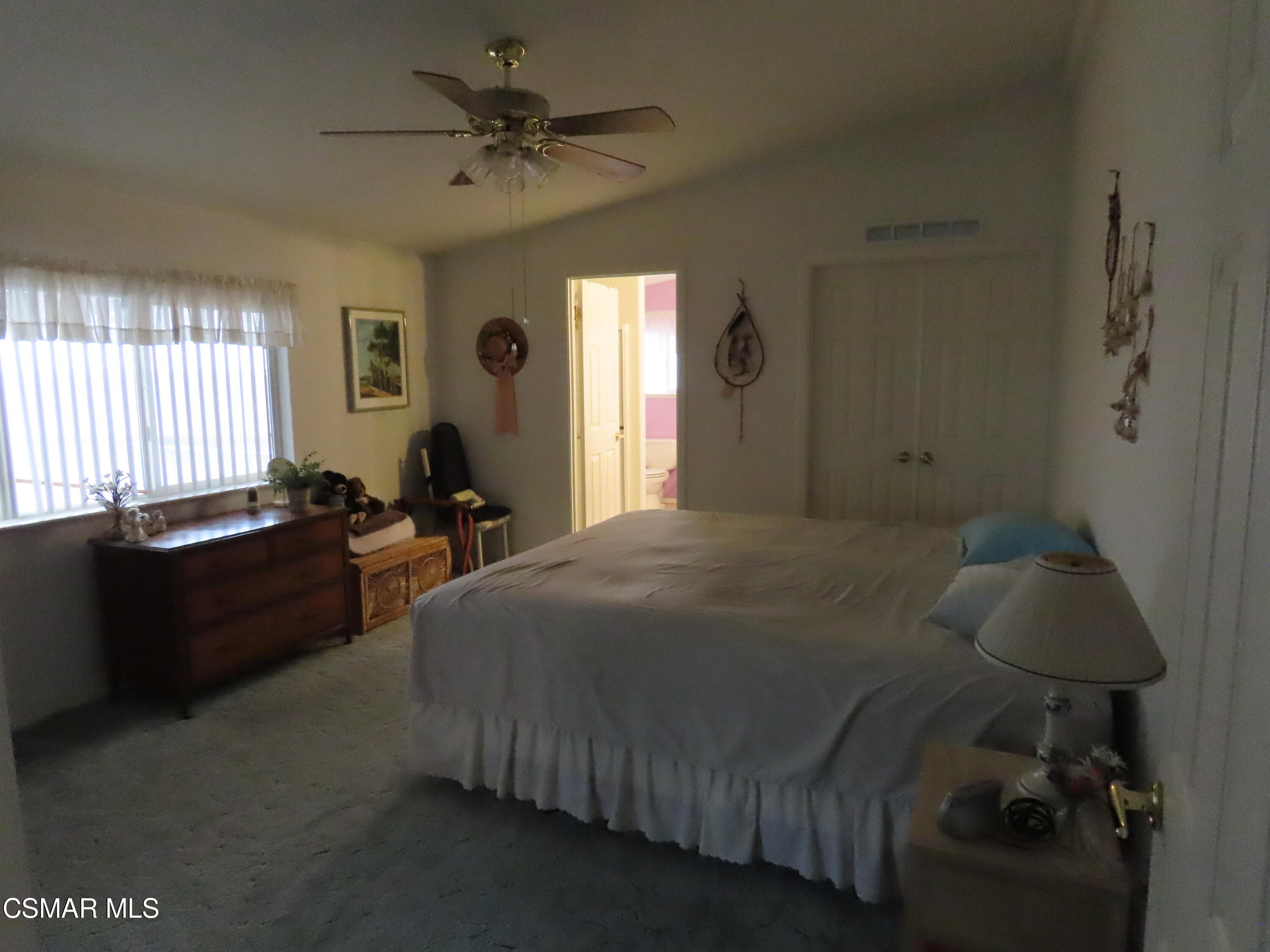 250 East Telegraph Road, Unit 58 Fillmore, CA 93015 - Photo 11 of 29 a bed sitting in a bedroom next to a window