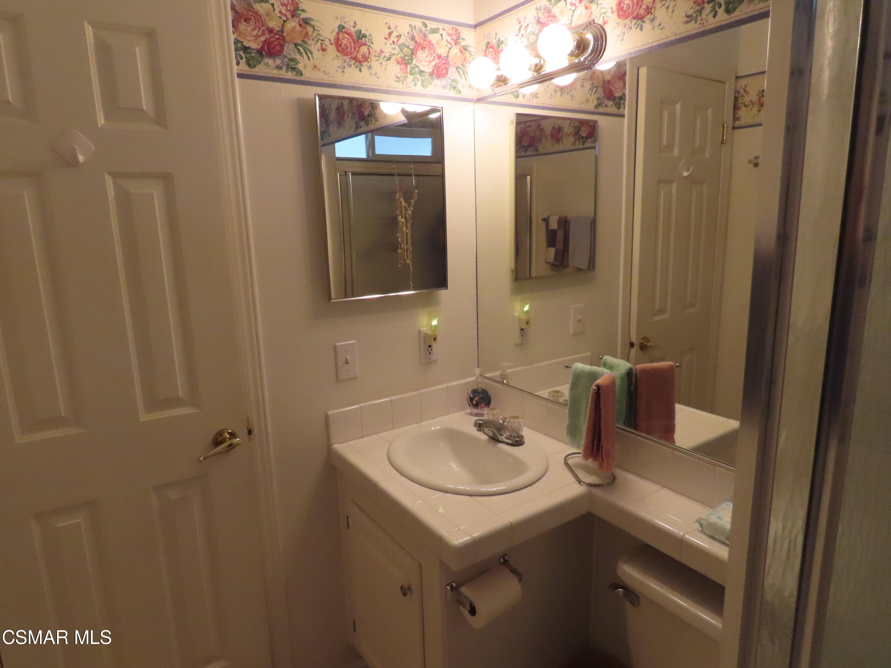 250 East Telegraph Road, Unit 58 Fillmore, CA 93015 - Photo 17 of 29 a bathroom with a sink and mirror