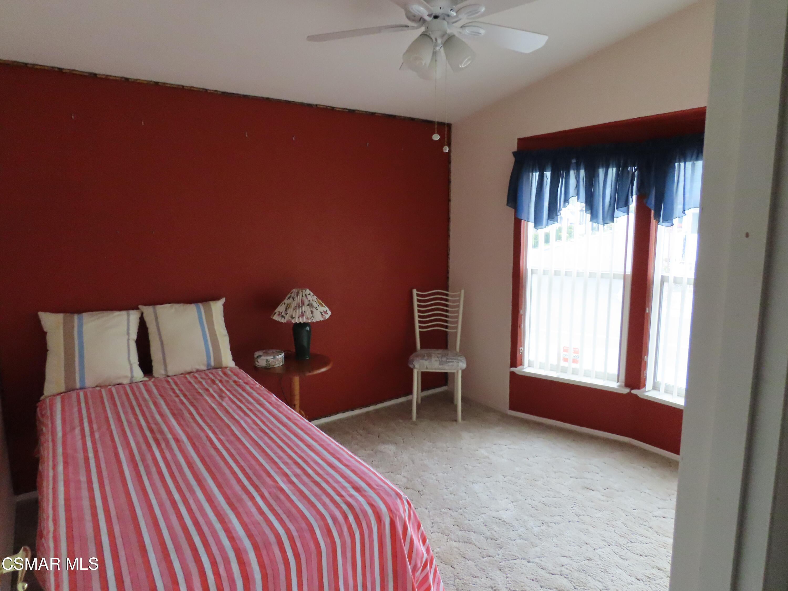 250 East Telegraph Road, Unit 58 Fillmore, CA 93015 - Photo 18 of 29 a bedroom with a bed and a window