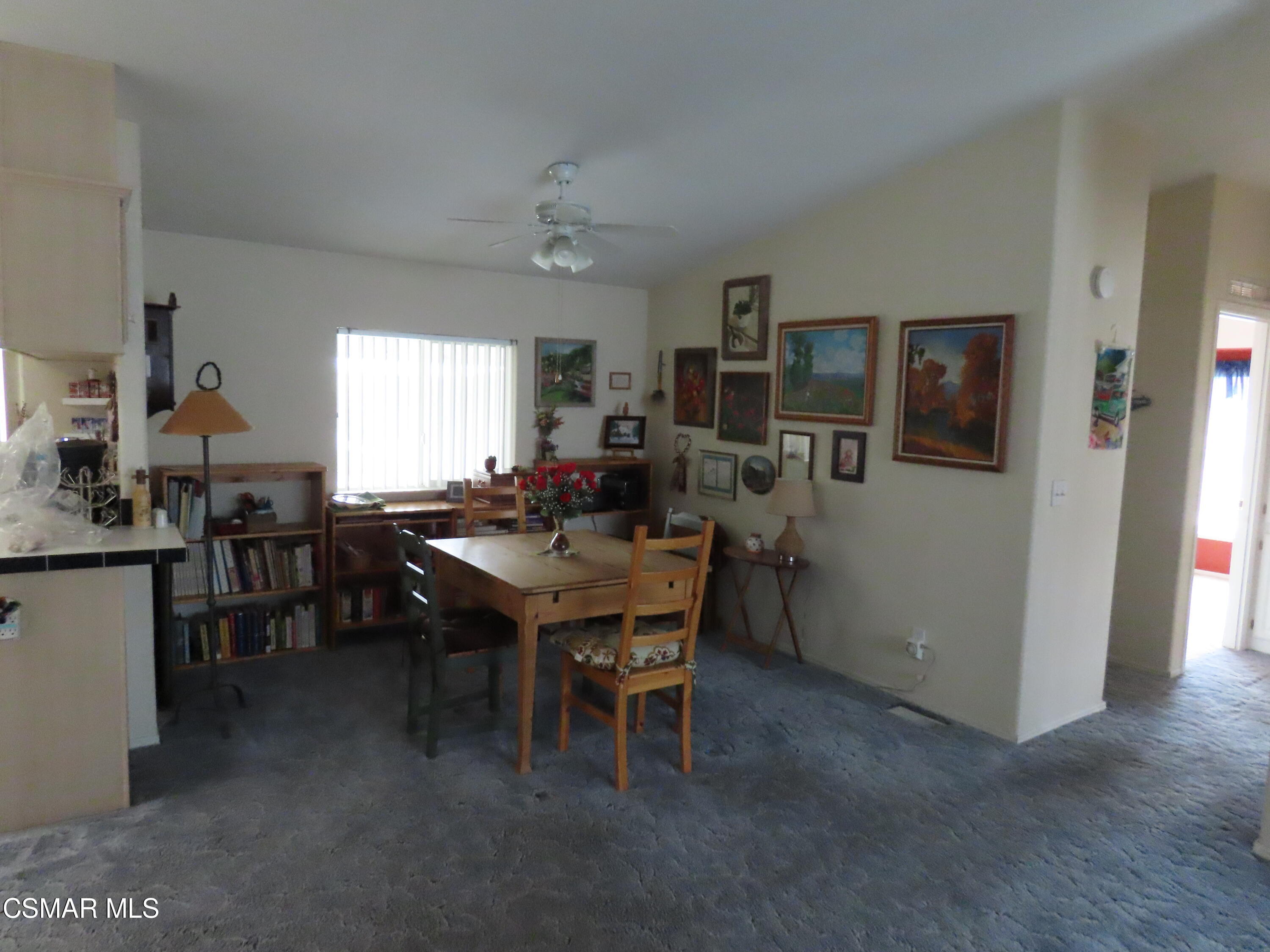 250 East Telegraph Road, Unit 58 Fillmore, CA 93015 - Photo 8 of 29 a kitchen with a table and chairs in it