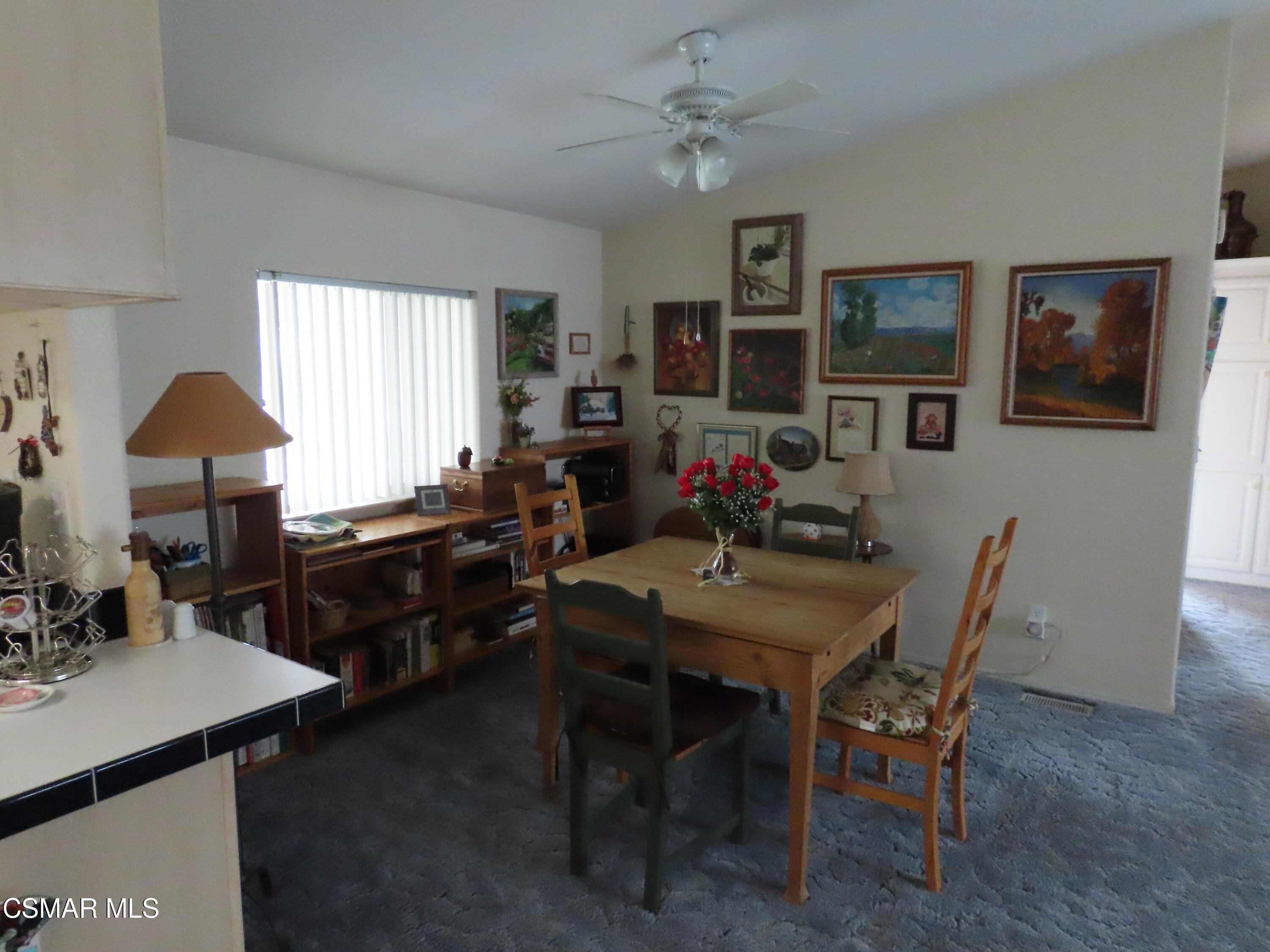 250 East Telegraph Road, Unit 58 Fillmore, CA 93015 - Photo 9 of 29 a view of a dining room with furniture and window