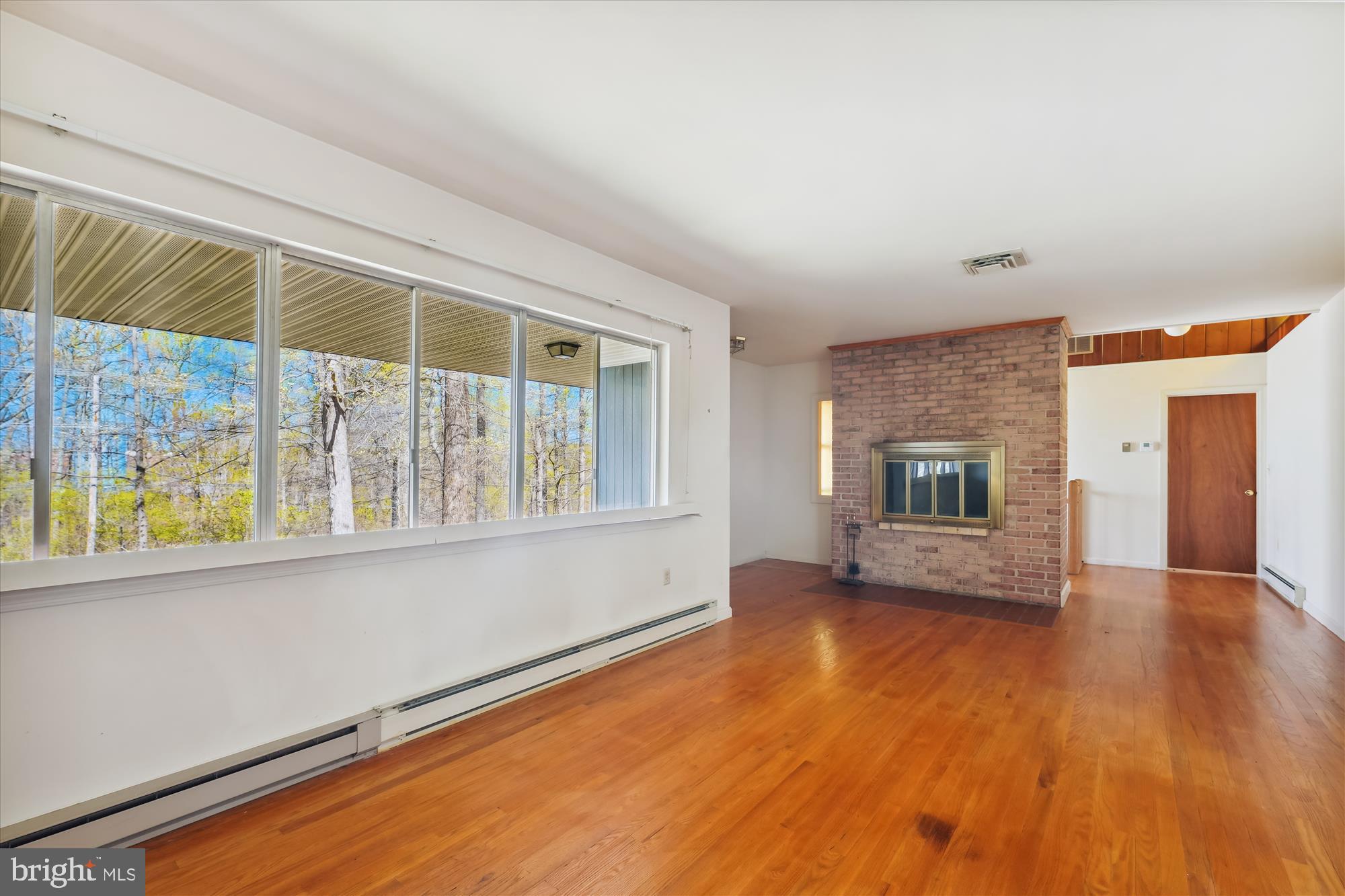 9457 Boyds Turn Road Owings, MD 20736 - Photo 5 of 34 Sunny Living Room with Fireplace