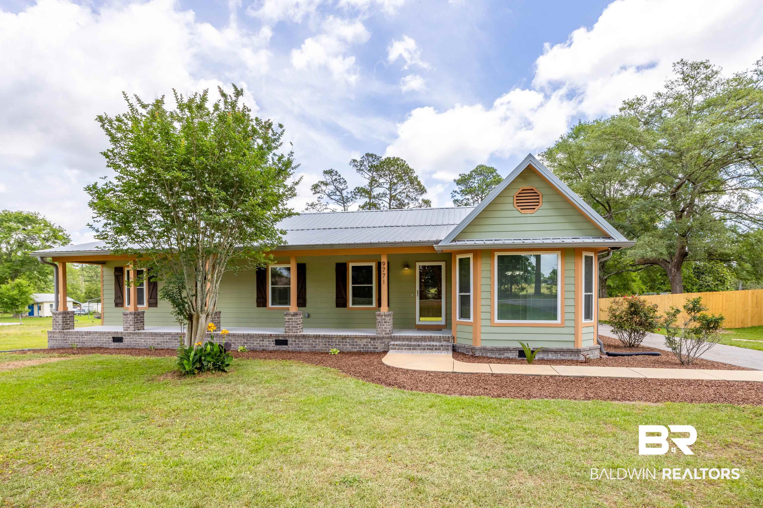 9771 Clarke Ridge Road Foley, AL 36535 - Photo 3 of 72 View of front facade with a front lawn.