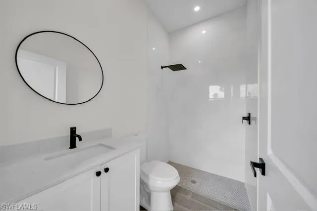 a view of kitchen with kitchen island and wooden floor