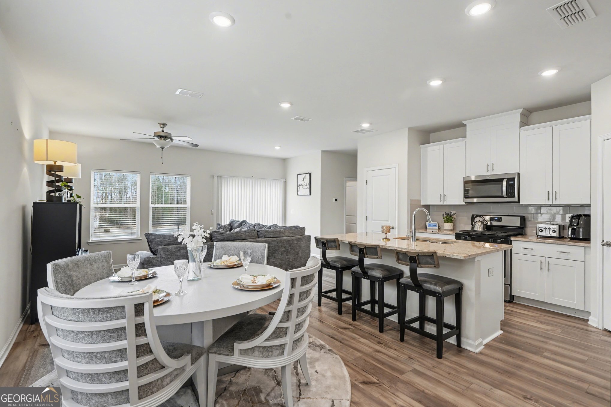 316 Warner Road McDonough, GA 30253 - Photo 1 of 27 a view of a dining room with furniture window and wooden floor