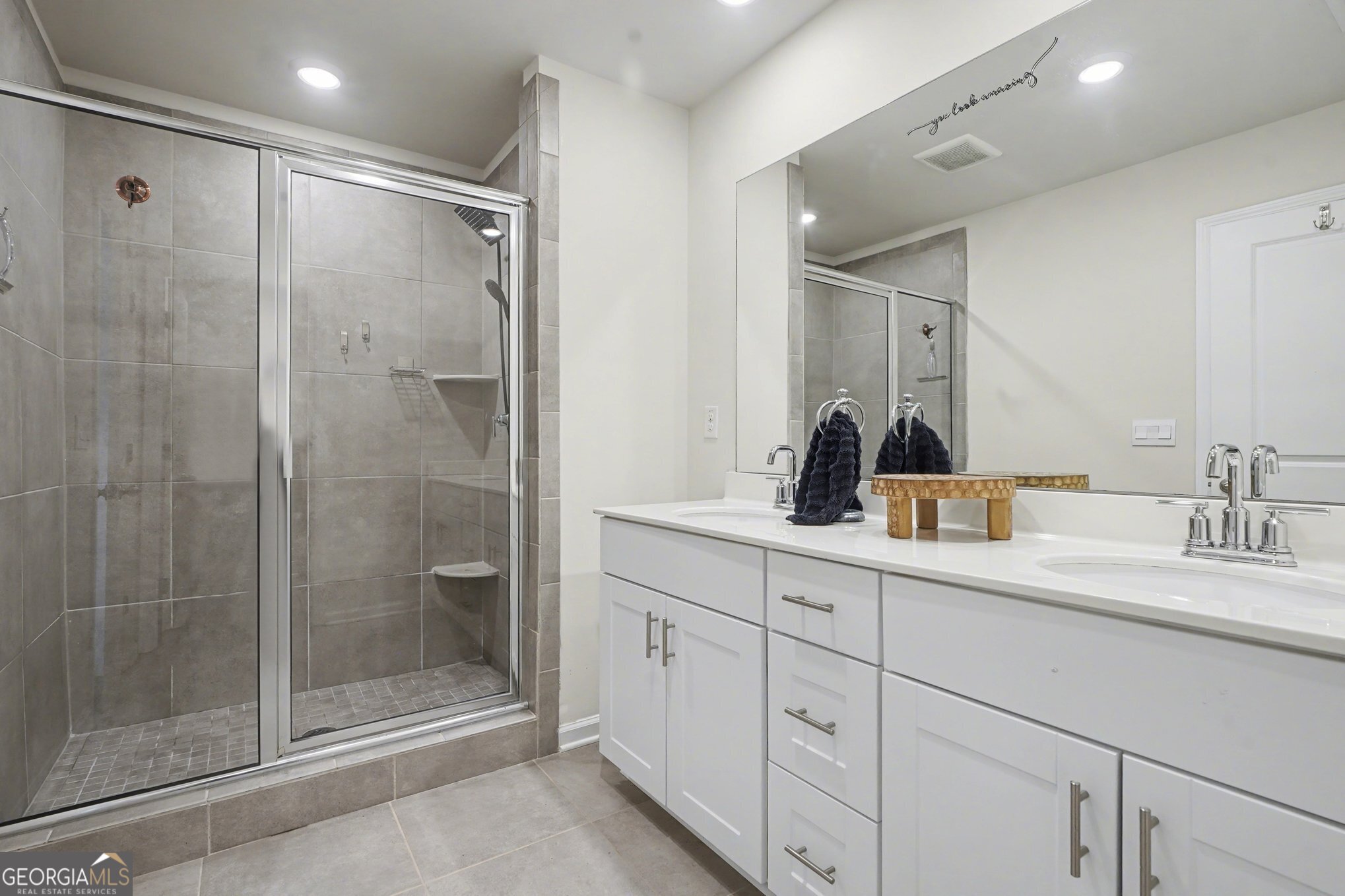 316 Warner Road McDonough, GA 30253 - Photo 12 of 27 a bathroom with a shower sink and mirror
