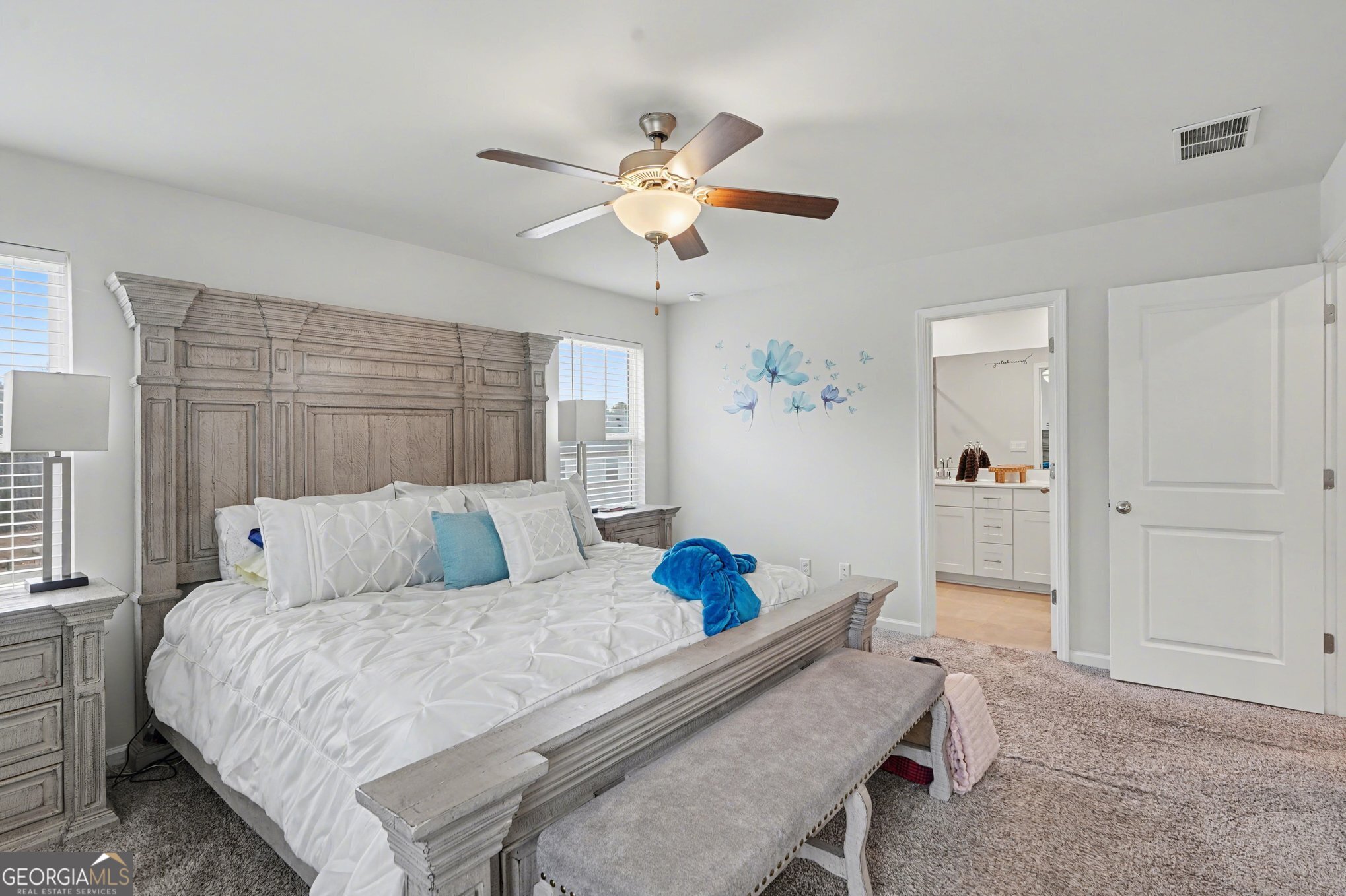 316 Warner Road McDonough, GA 30253 - Photo 14 of 27 a bedroom with a bed and a chandelier