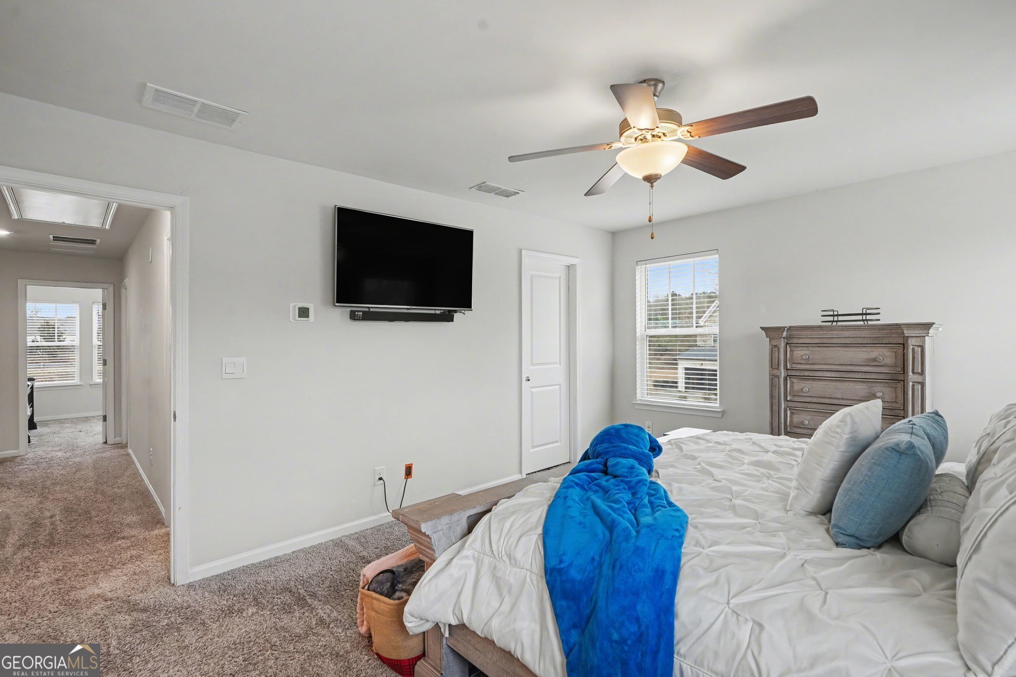 316 Warner Road McDonough, GA 30253 - Photo 15 of 27 a bedroom with a bed and a flat screen tv