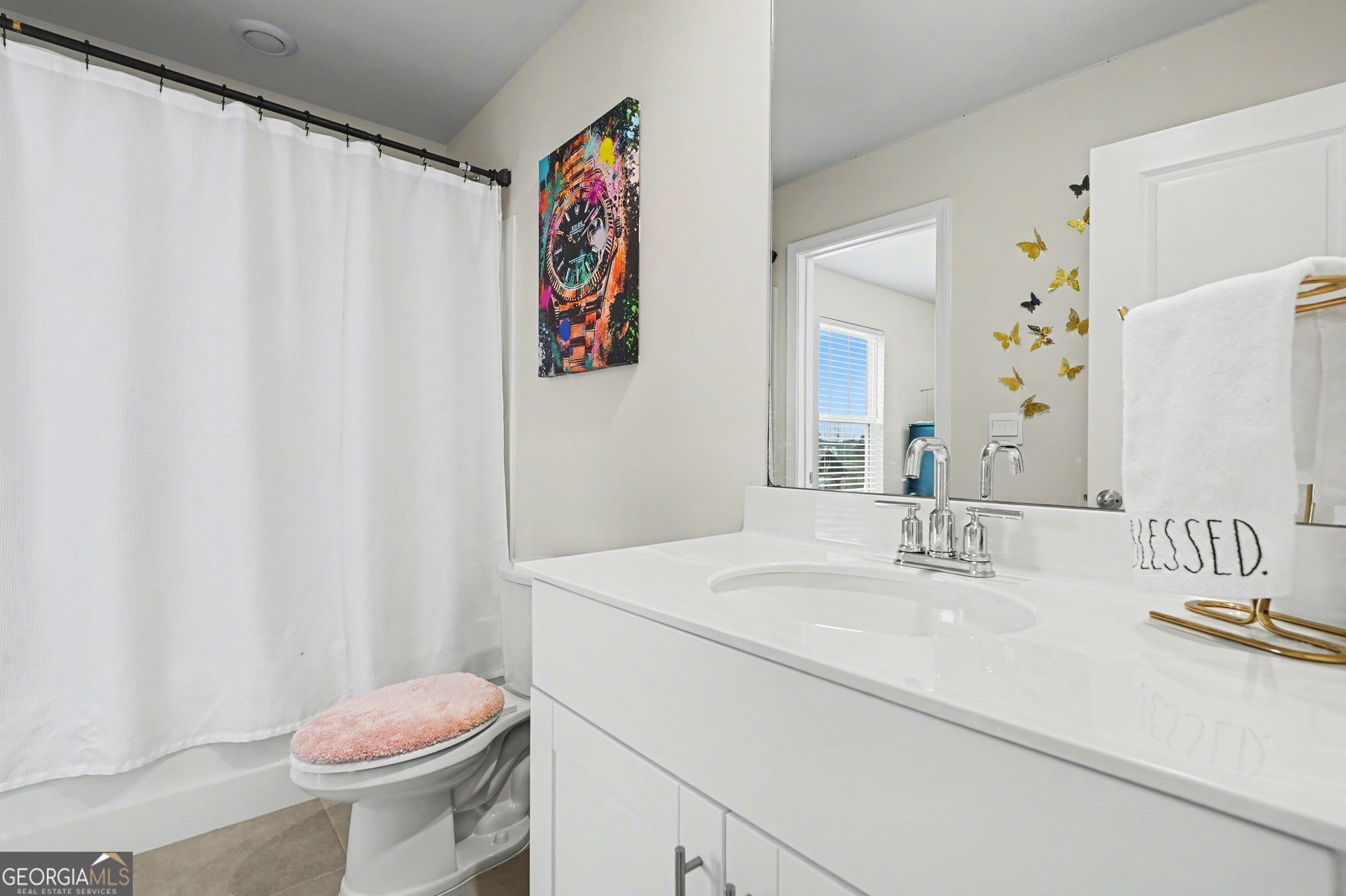 316 Warner Road McDonough, GA 30253 - Photo 18 of 27 a bathroom with a sink a toilet and a mirror