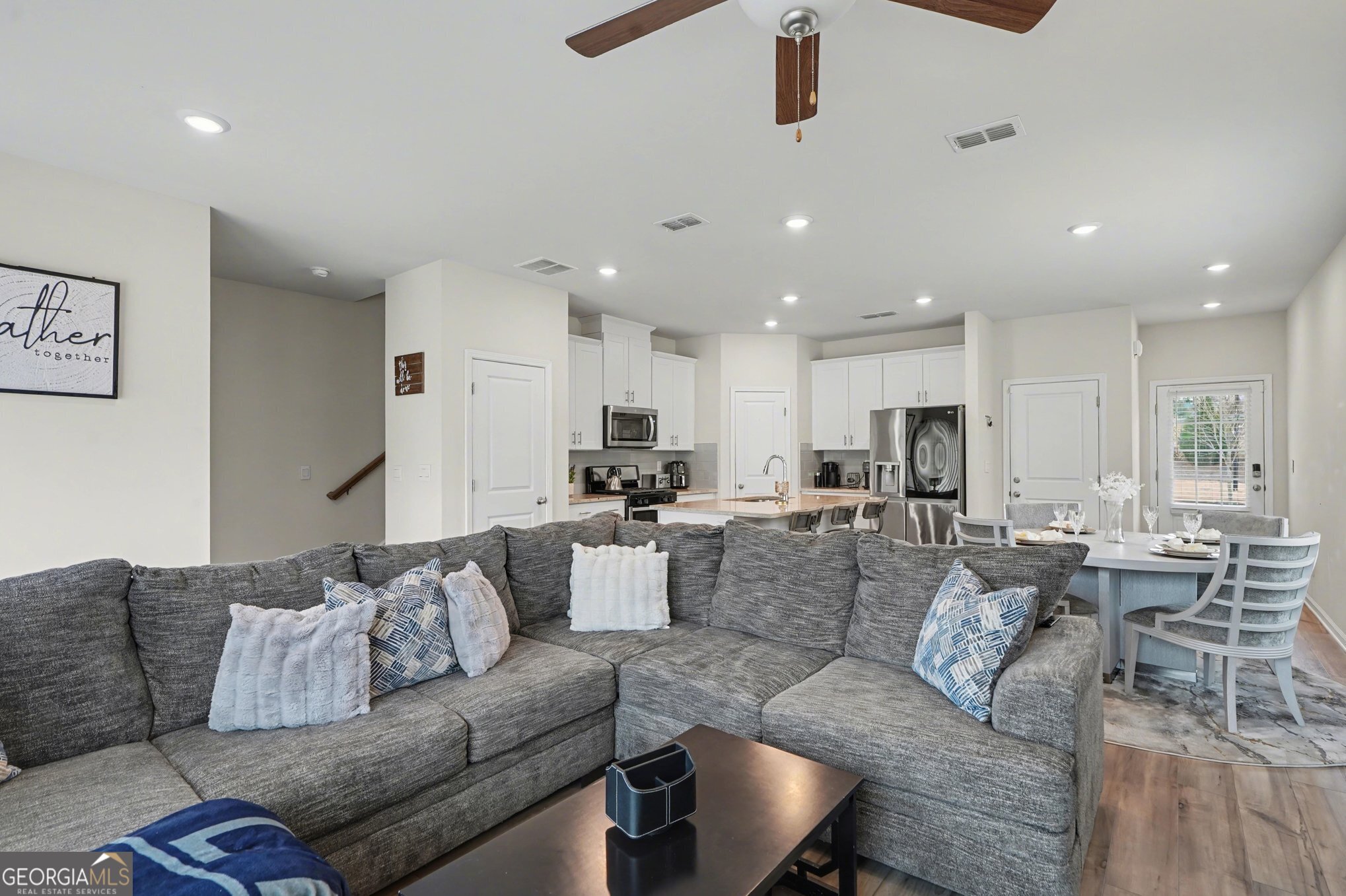 316 Warner Road McDonough, GA 30253 - Photo 5 of 27 a living room with furniture kitchen view and a chandelier
