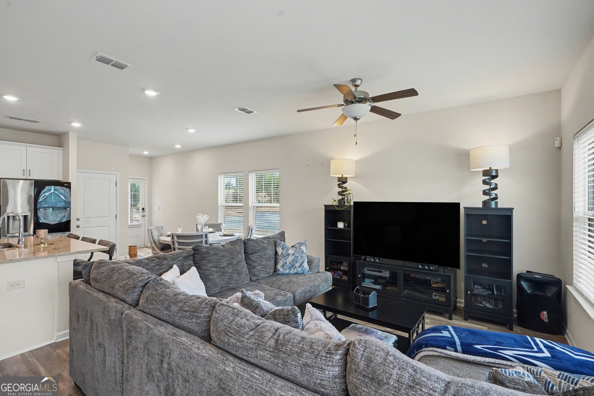 316 Warner Road McDonough, GA 30253 - Photo 6 of 27 a living room with furniture a flat screen tv and a fireplace