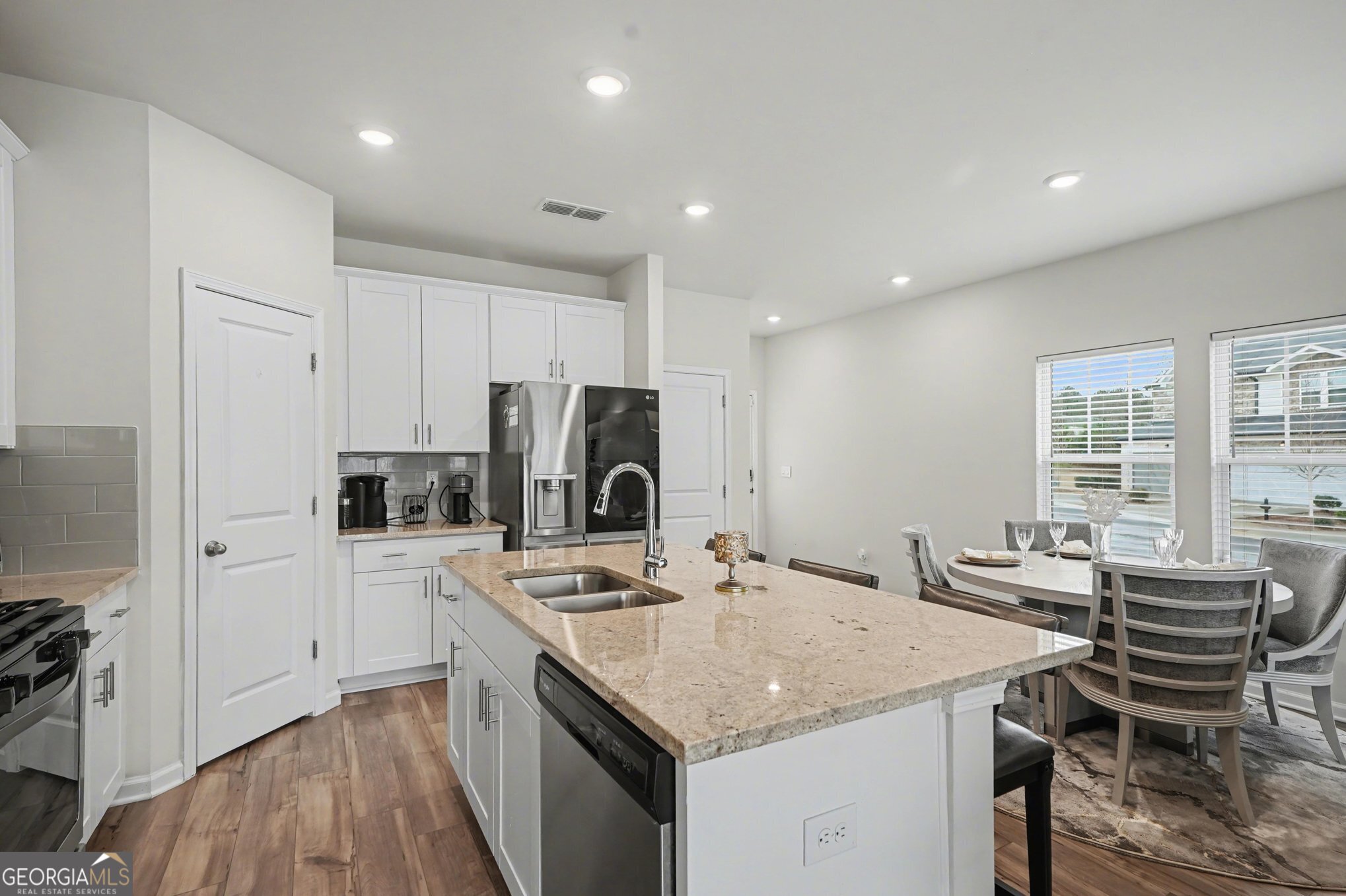 316 Warner Road McDonough, GA 30253 - Photo 8 of 27 a kitchen with a stove a refrigerator and a sink