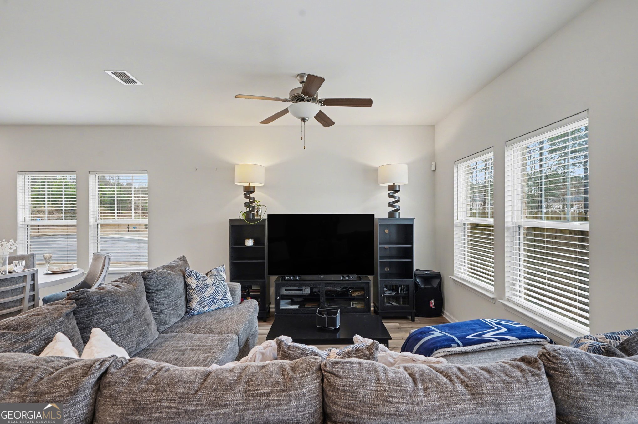 316 Warner Road McDonough, GA 30253 - Photo 9 of 27 a living room with furniture a large window and a flat screen tv
