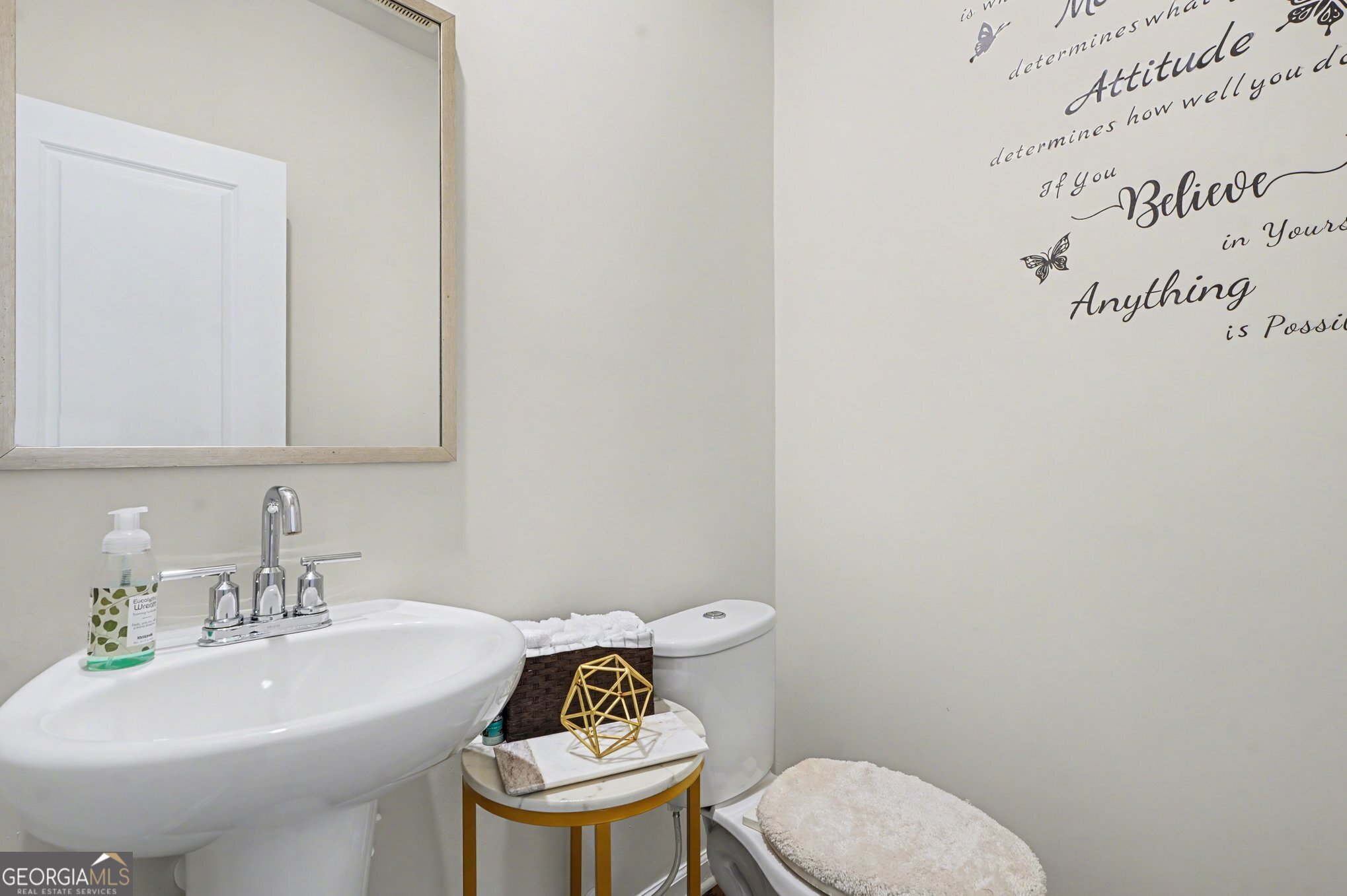 316 Warner Road McDonough, GA 30253 - Photo 10 of 27 a bathroom with a sink a toilet and mirror