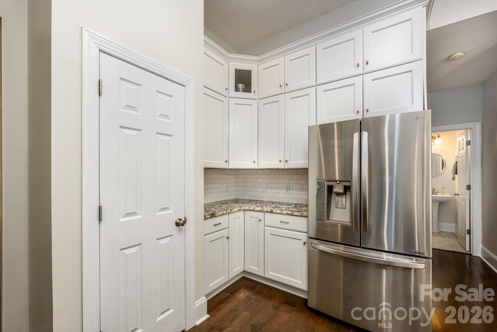 7867 Golf Course Drive North Denver, NC 28037 - Photo 12 of 34 a kitchen with cabinets and stainless steel appliances