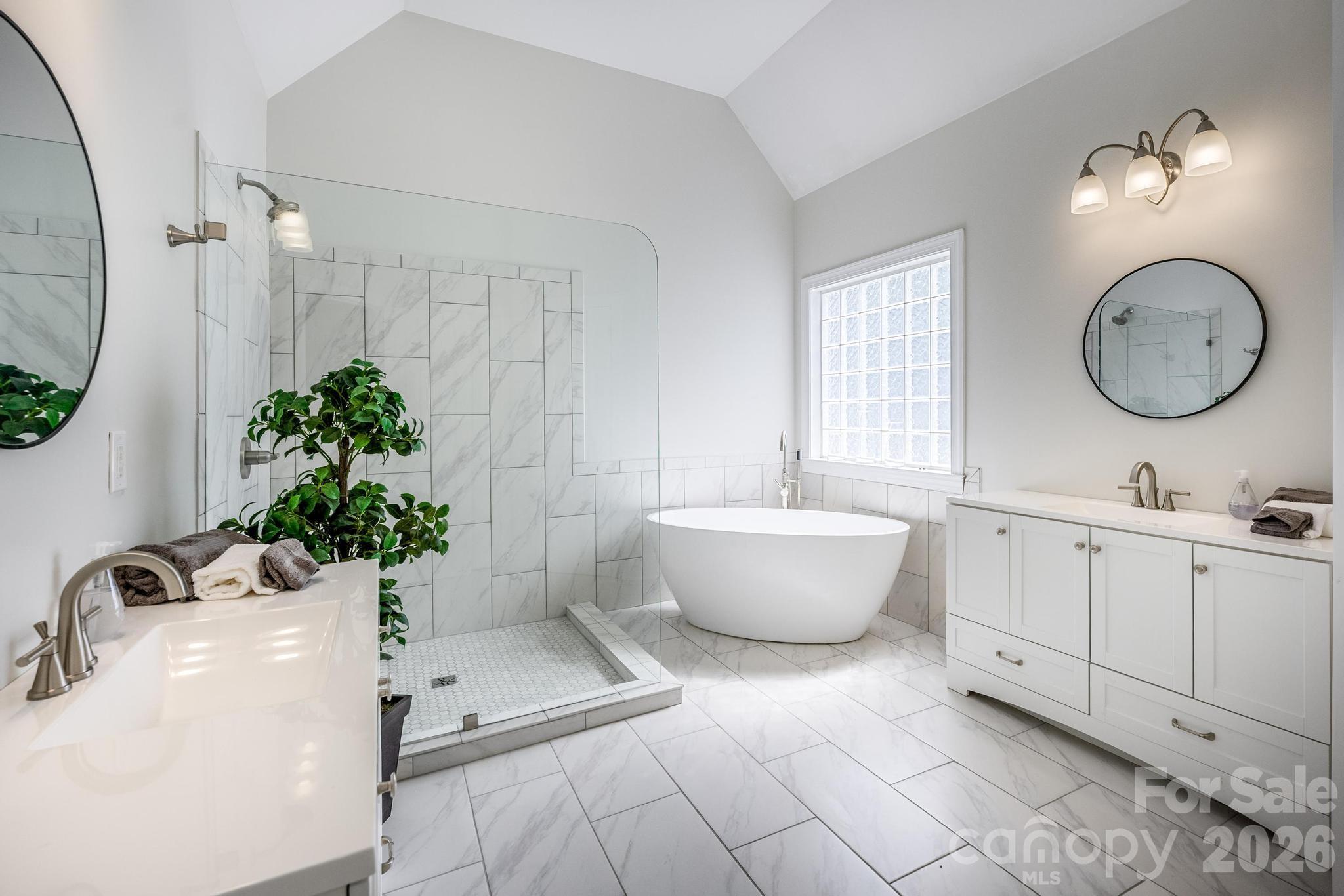 7867 Golf Course Drive North Denver, NC 28037 - Photo 16 of 34 a bathroom with a white tub sink and mirror