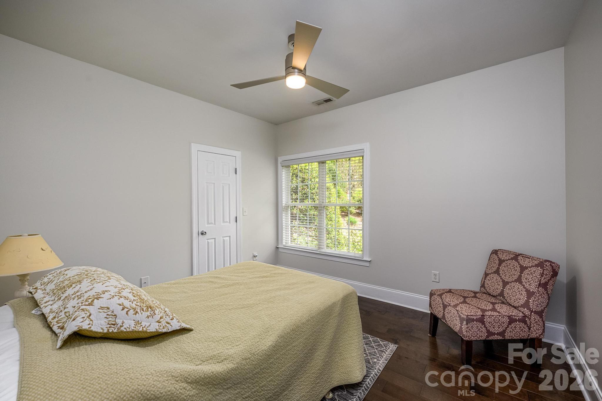 7867 Golf Course Drive North Denver, NC 28037 - Photo 21 of 34 a bedroom with a bed and chair