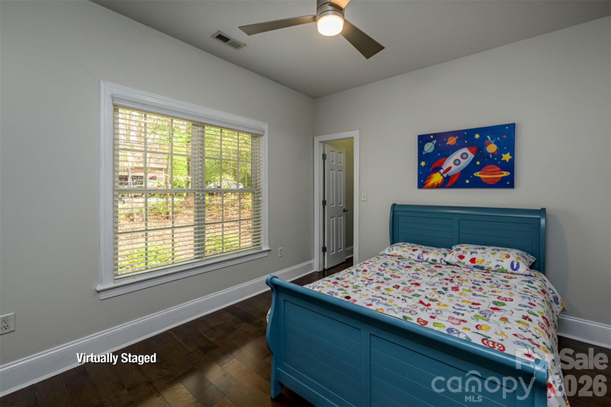 7867 Golf Course Drive North Denver, NC 28037 - Photo 22 of 34 a bedroom with a bed and a chandelier