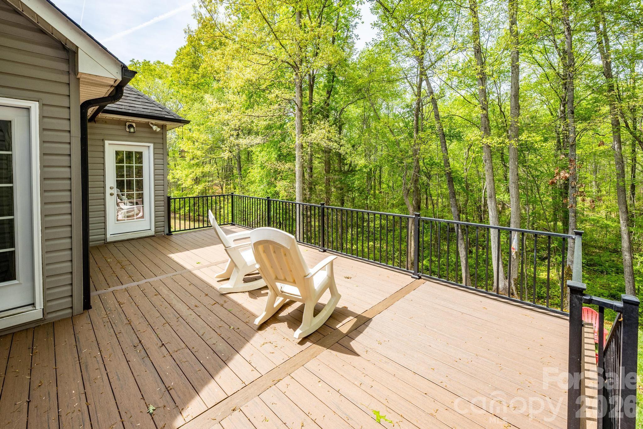 7867 Golf Course Drive North Denver, NC 28037 - Photo 24 of 34 a view of a deck with wooden floor and outdoor seating