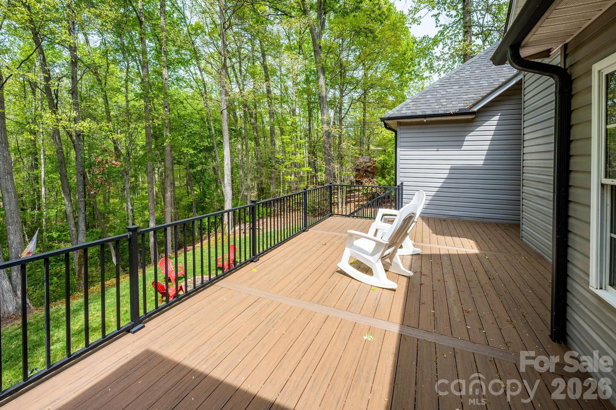 7867 Golf Course Drive North Denver, NC 28037 - Photo 25 of 34 a view of a wooden deck and a backyard