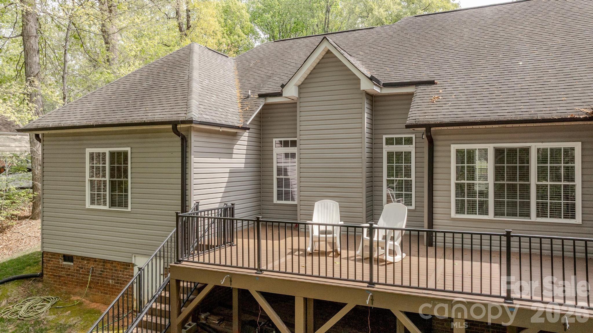 7867 Golf Course Drive North Denver, NC 28037 - Photo 26 of 34 a view of a house with a deck