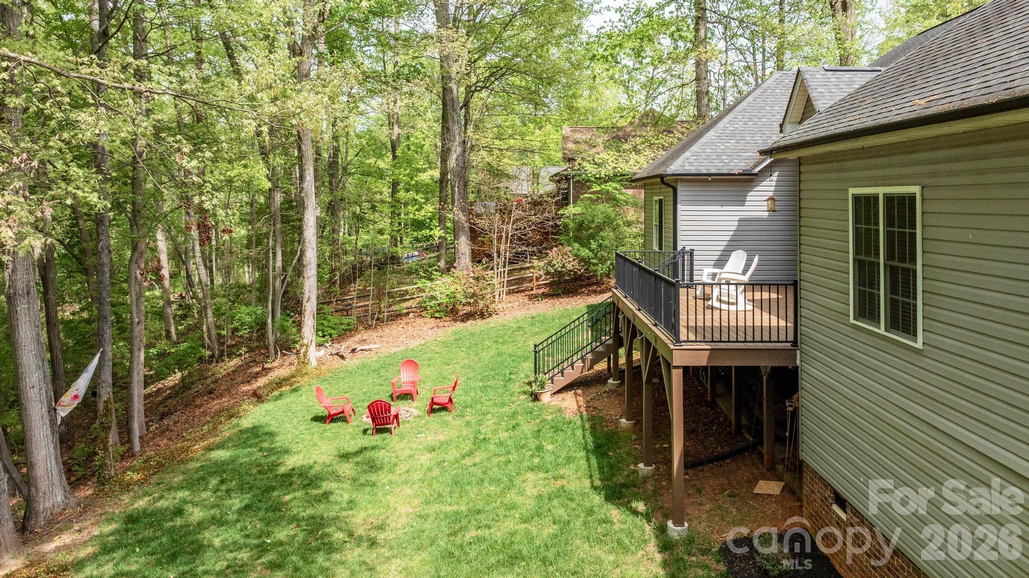 7867 Golf Course Drive North Denver, NC 28037 - Photo 29 of 34 a backyard of a house with table and chairs
