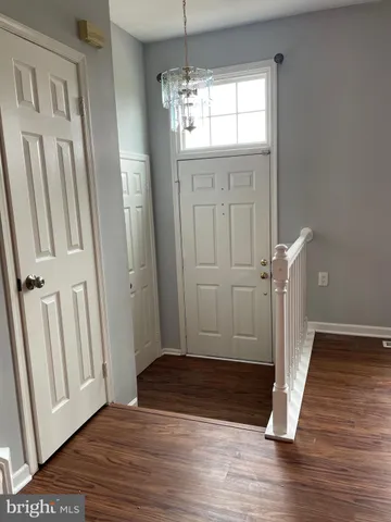 a view of entryway with wooden floor
