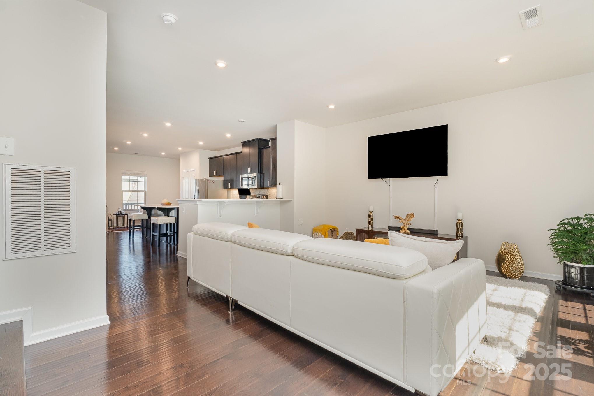 3718 Speer Boulevard Charlotte, NC 28217 - Photo 11 of 48 a living room with furniture and a flat screen tv