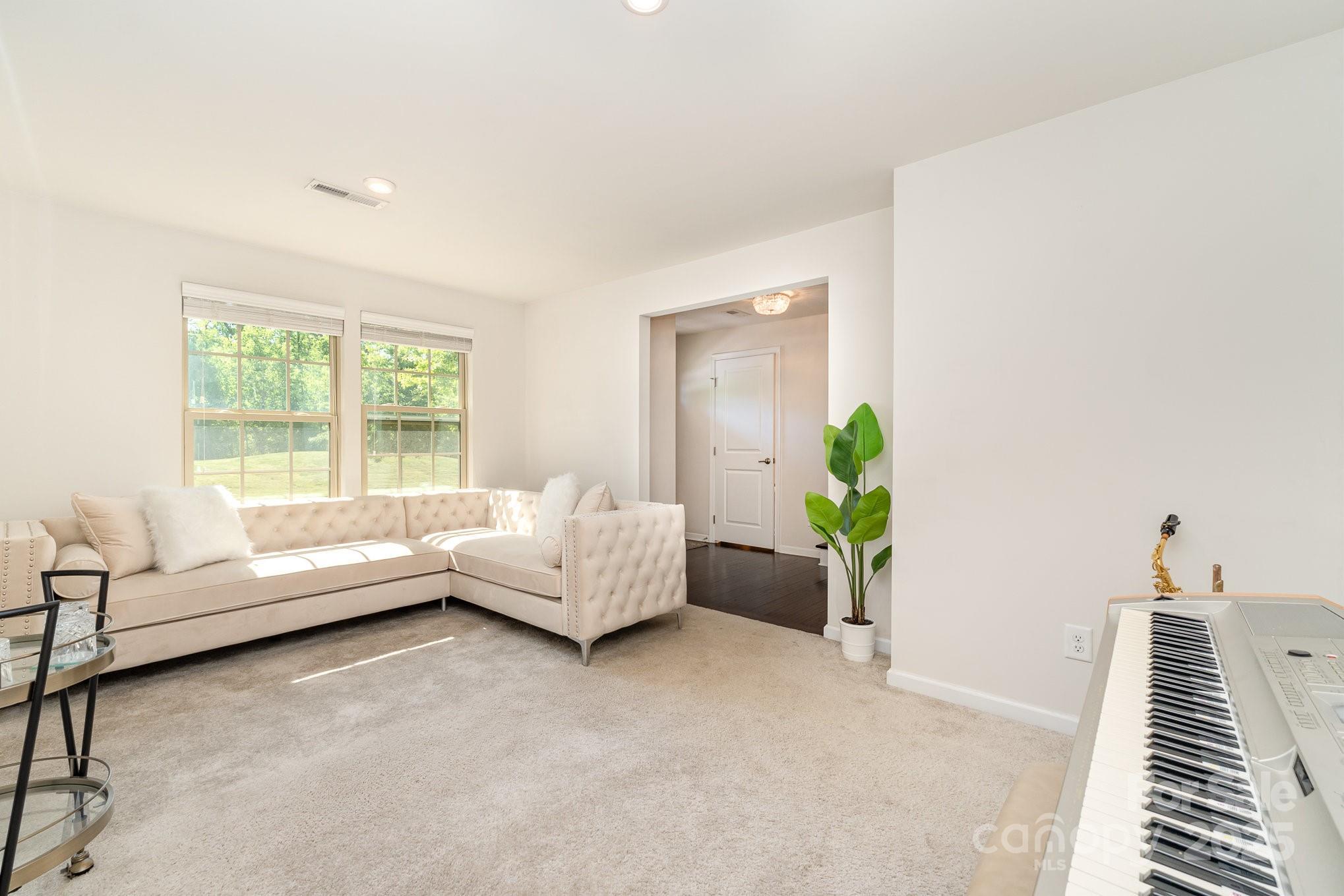3718 Speer Boulevard Charlotte, NC 28217 - Photo 14 of 48 a living room with furniture and a window