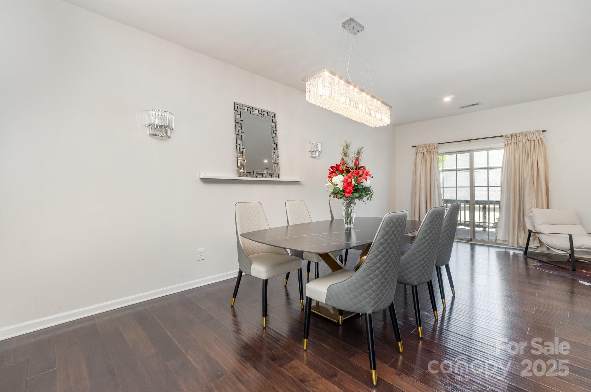 3718 Speer Boulevard Charlotte, NC 28217 - Photo 15 of 48 a view of a dining room with furniture and wooden floor