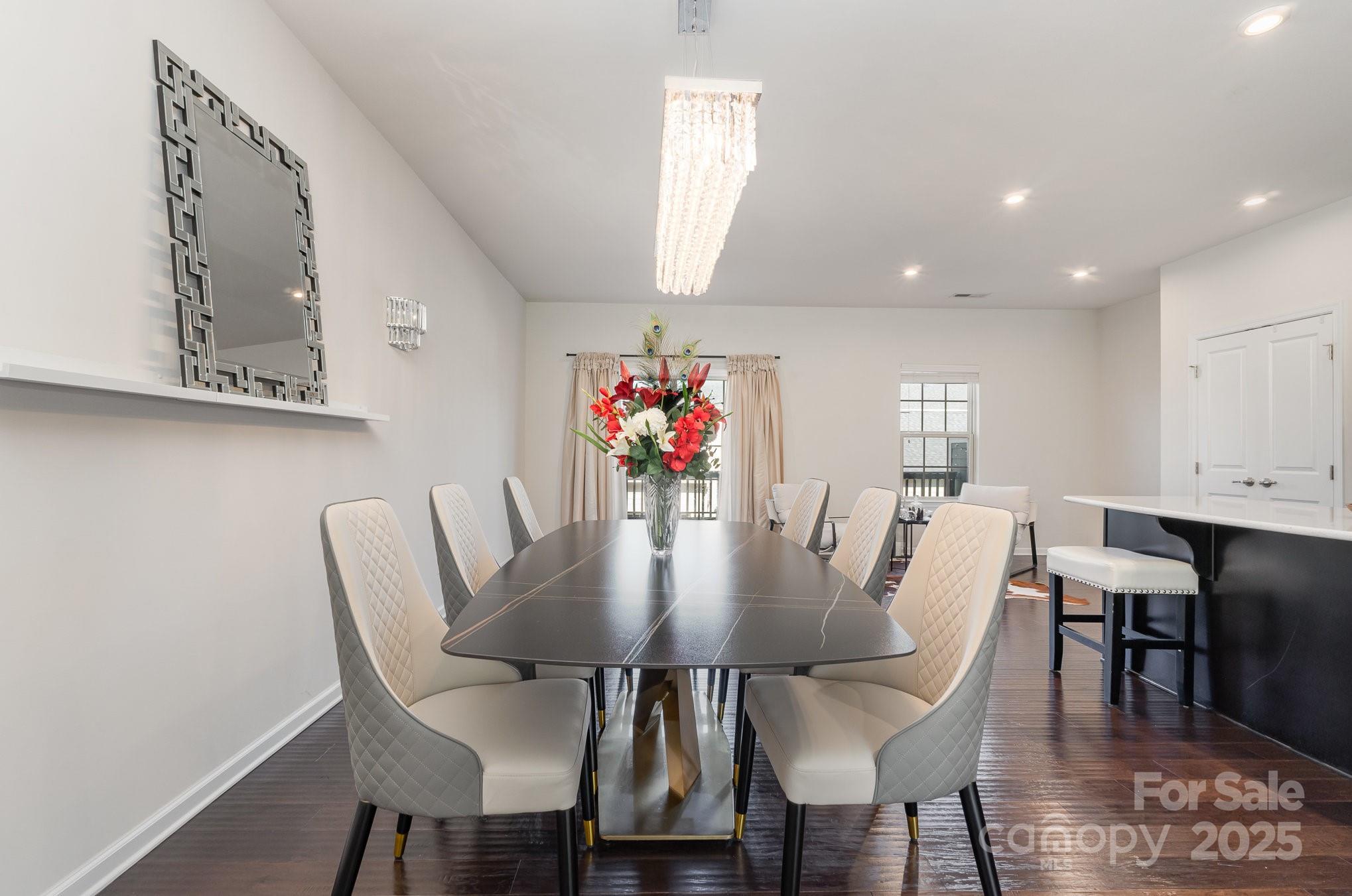 3718 Speer Boulevard Charlotte, NC 28217 - Photo 16 of 48 a view of a dining room with furniture and wooden floor