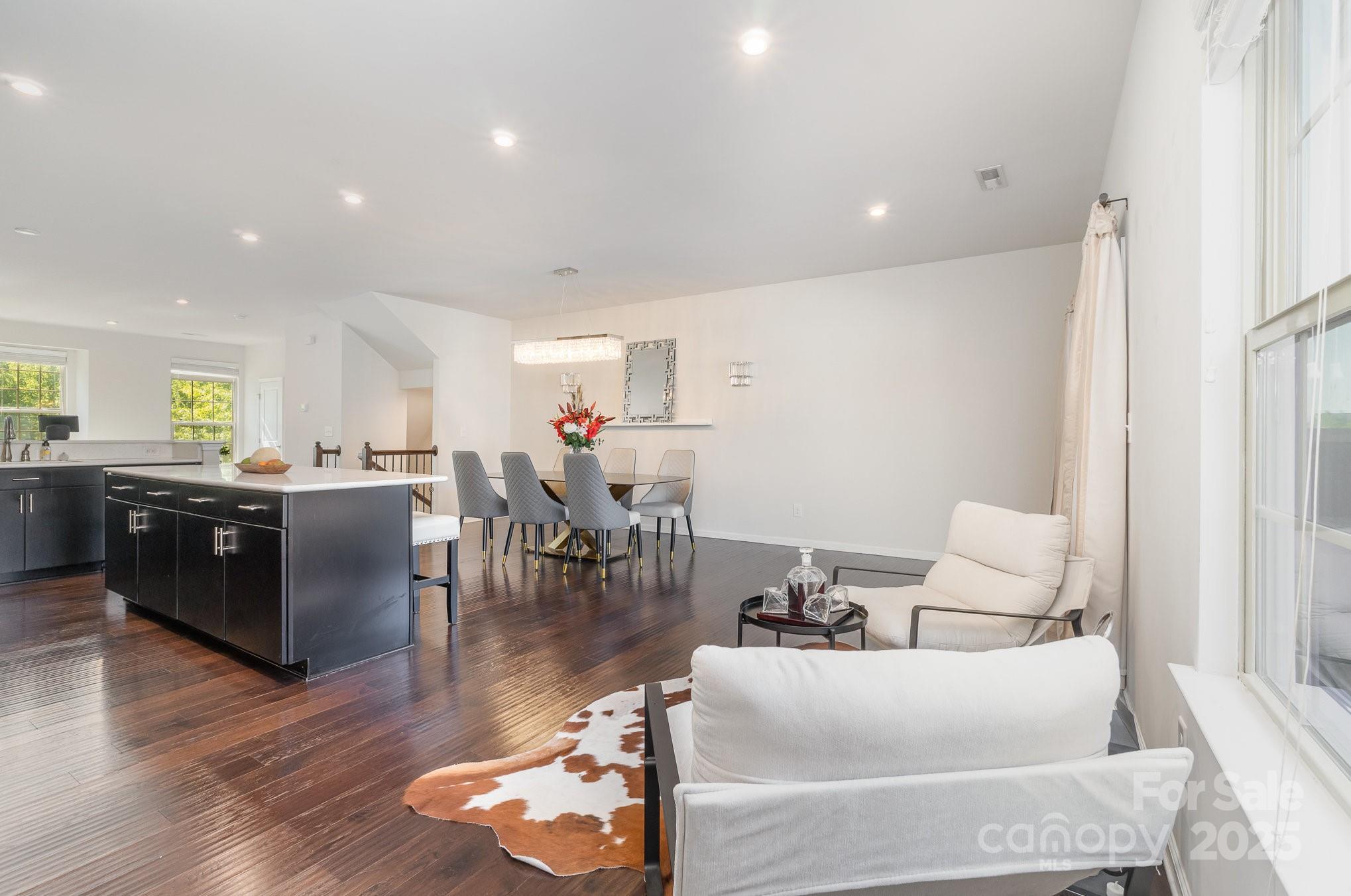 3718 Speer Boulevard Charlotte, NC 28217 - Photo 18 of 48 a living room with furniture and kitchen view with wooden floor