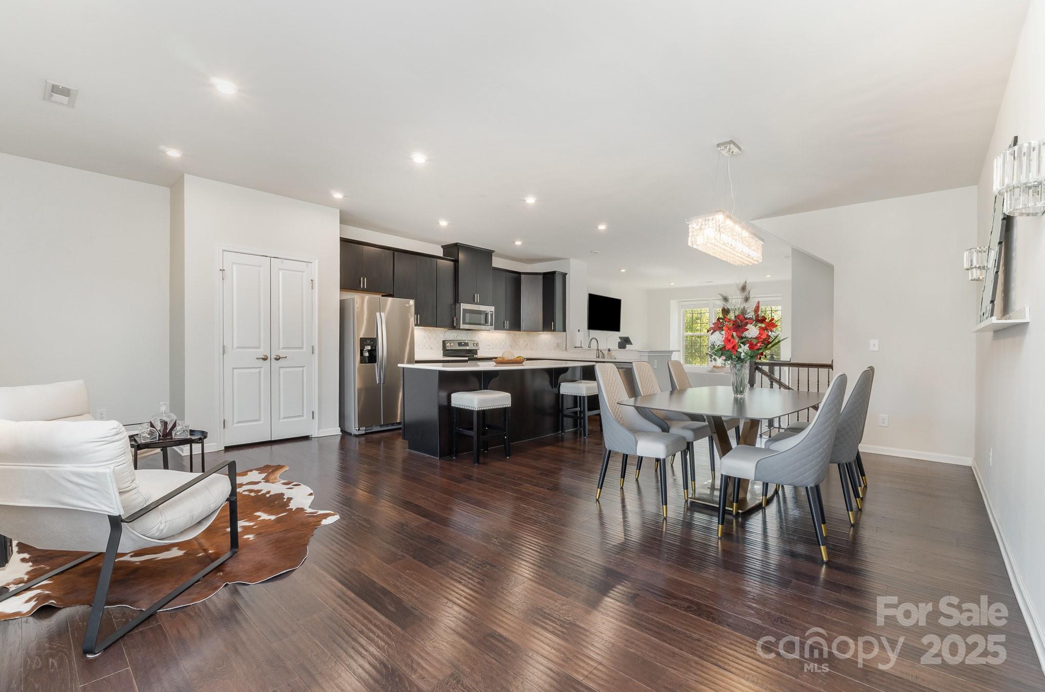 3718 Speer Boulevard Charlotte, NC 28217 - Photo 19 of 48 a view of a dining room with furniture and wooden floor