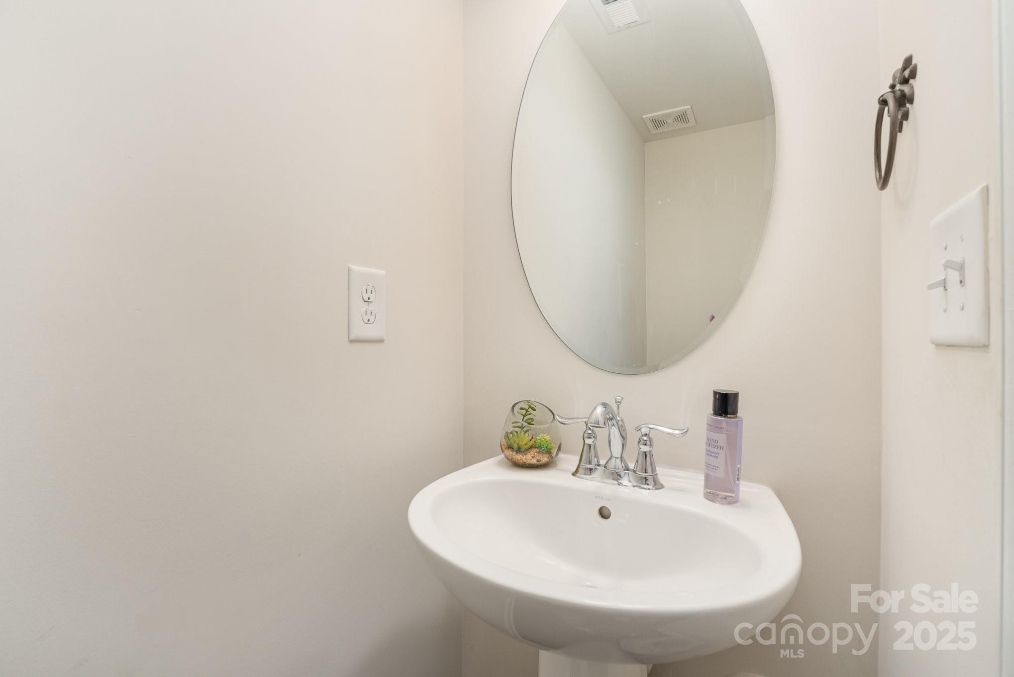 3718 Speer Boulevard Charlotte, NC 28217 - Photo 26 of 48 a bathroom with a sink and a mirror