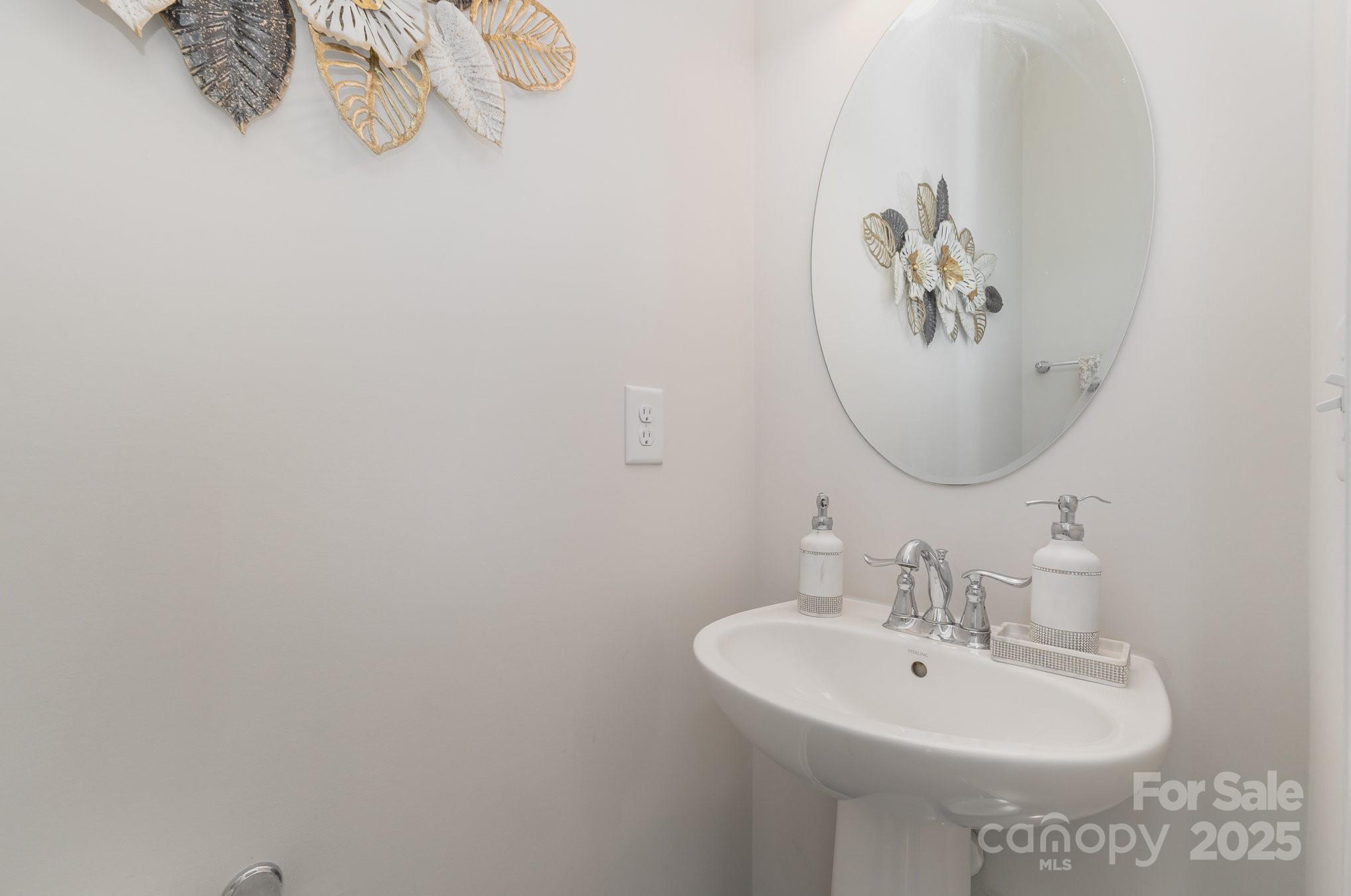 3718 Speer Boulevard Charlotte, NC 28217 - Photo 27 of 48 a bathroom with a sink and a mirror