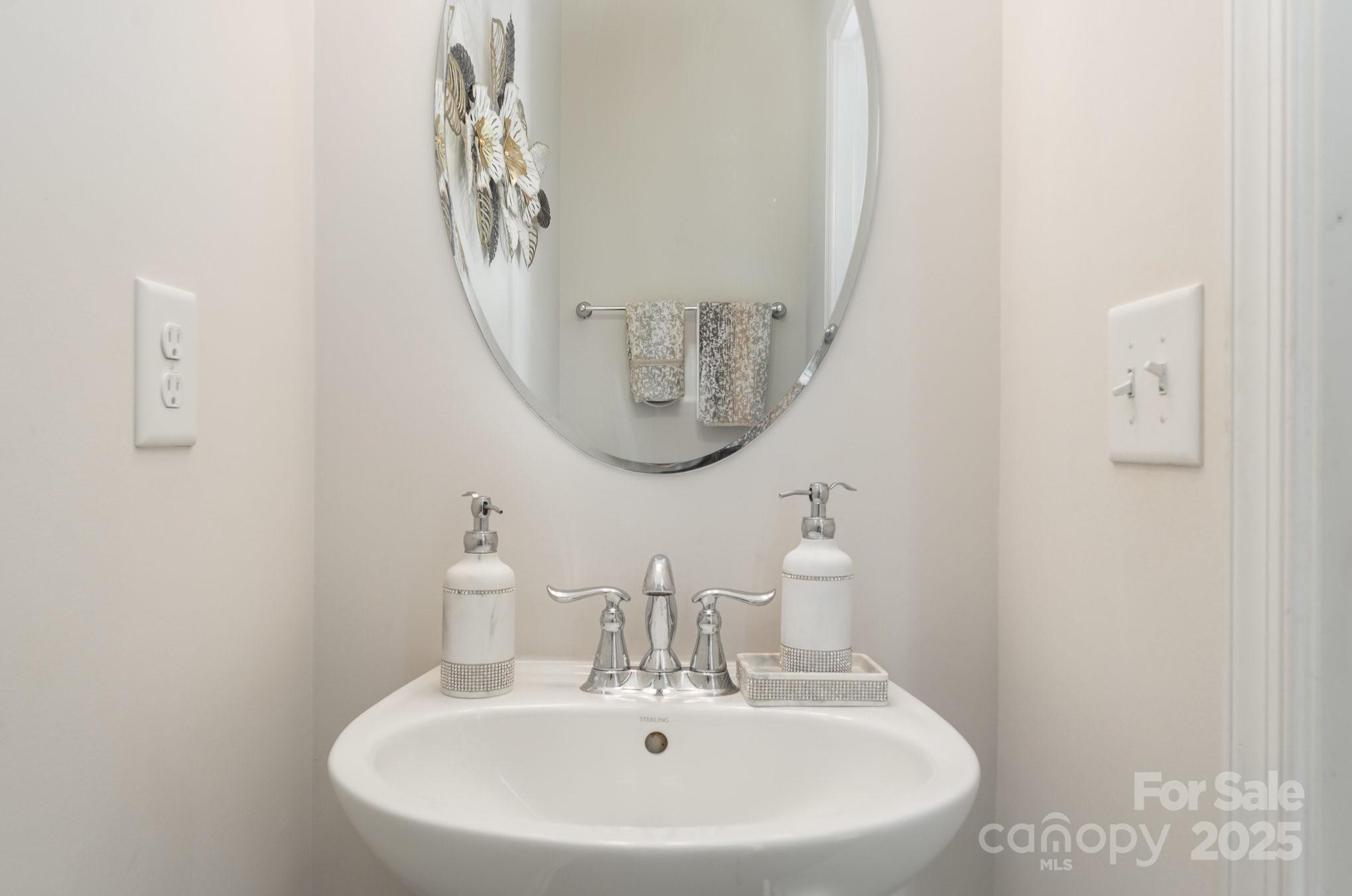 3718 Speer Boulevard Charlotte, NC 28217 - Photo 28 of 48 a bathroom with a sink and a mirror