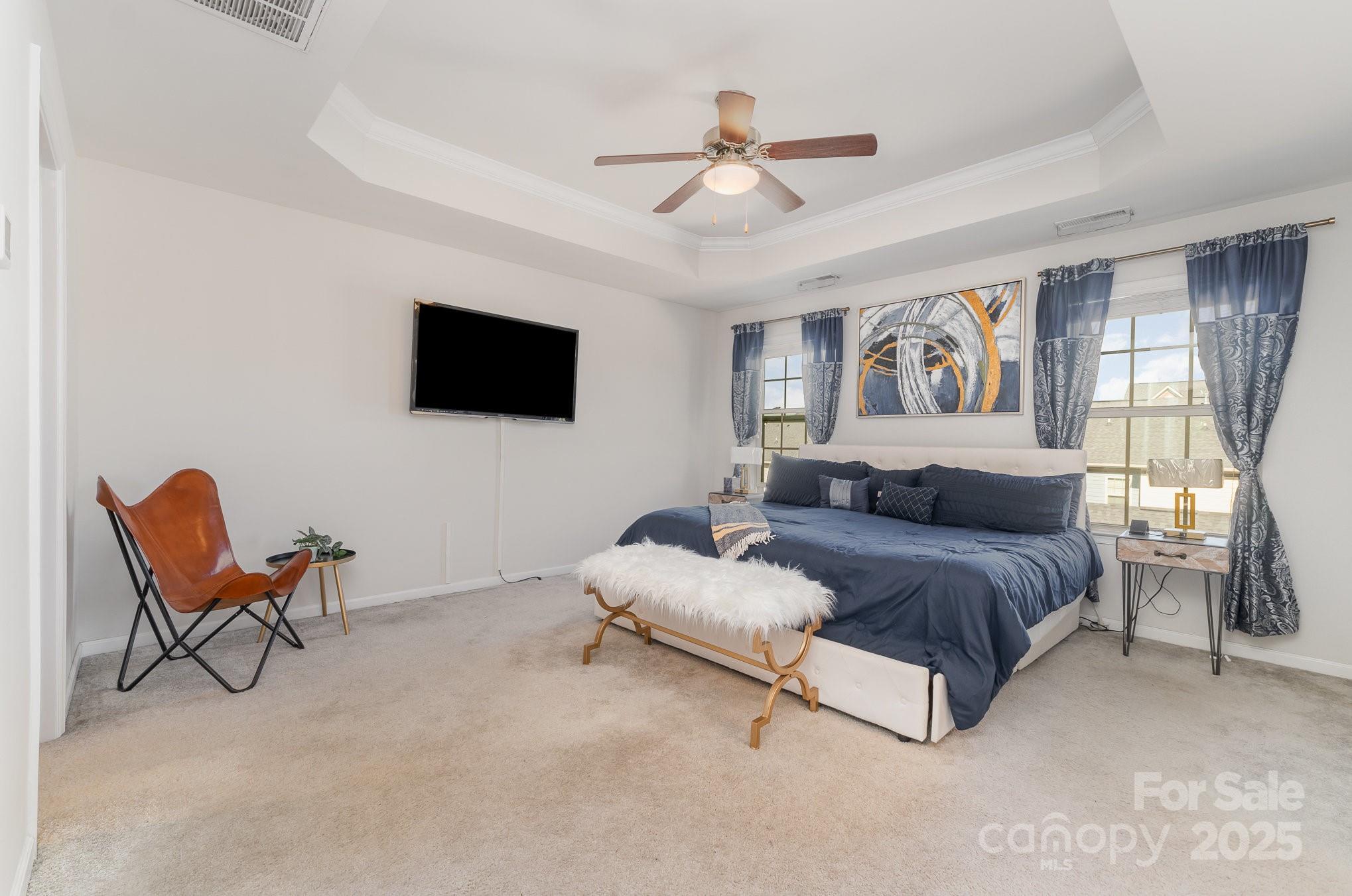 3718 Speer Boulevard Charlotte, NC 28217 - Photo 30 of 48 a spacious bedroom with a bed and furniture