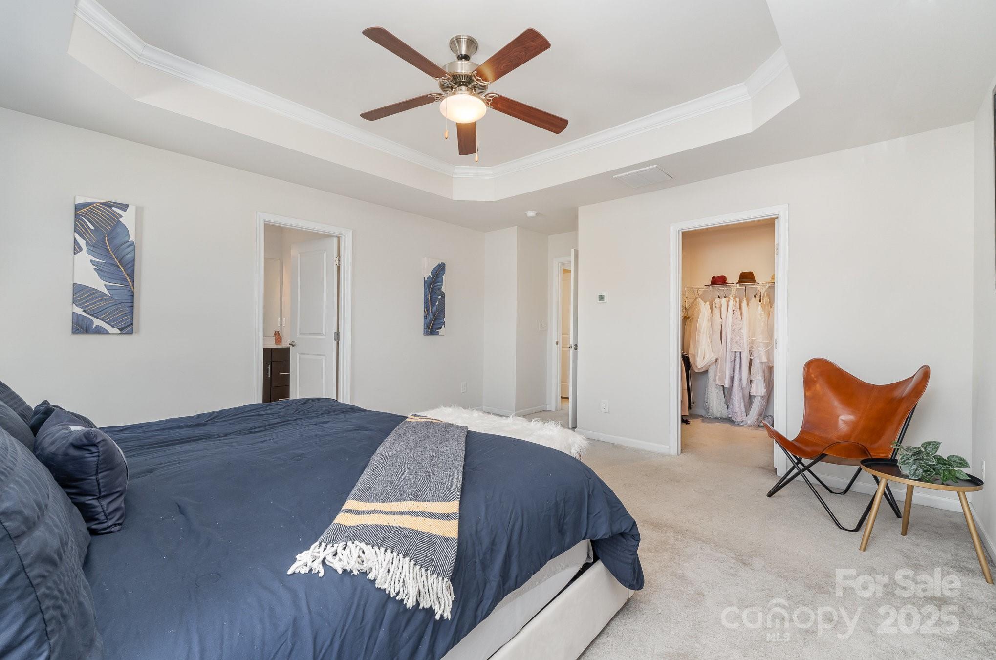 3718 Speer Boulevard Charlotte, NC 28217 - Photo 31 of 48 a bedroom with a bed and a chair