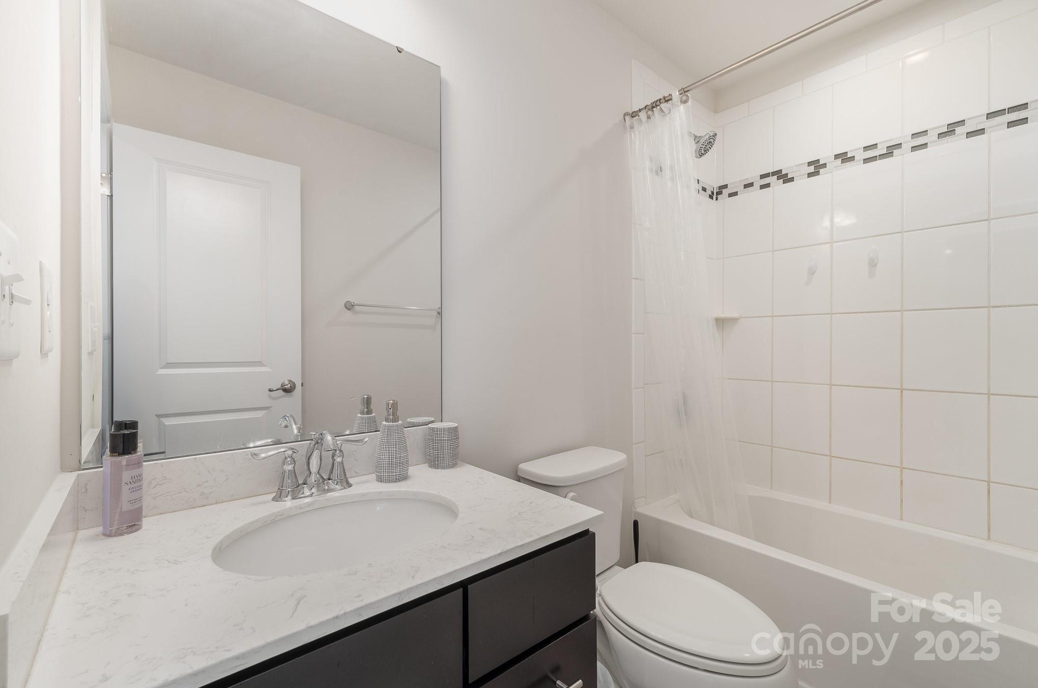 3718 Speer Boulevard Charlotte, NC 28217 - Photo 38 of 48 a bathroom with a sink a toilet and shower