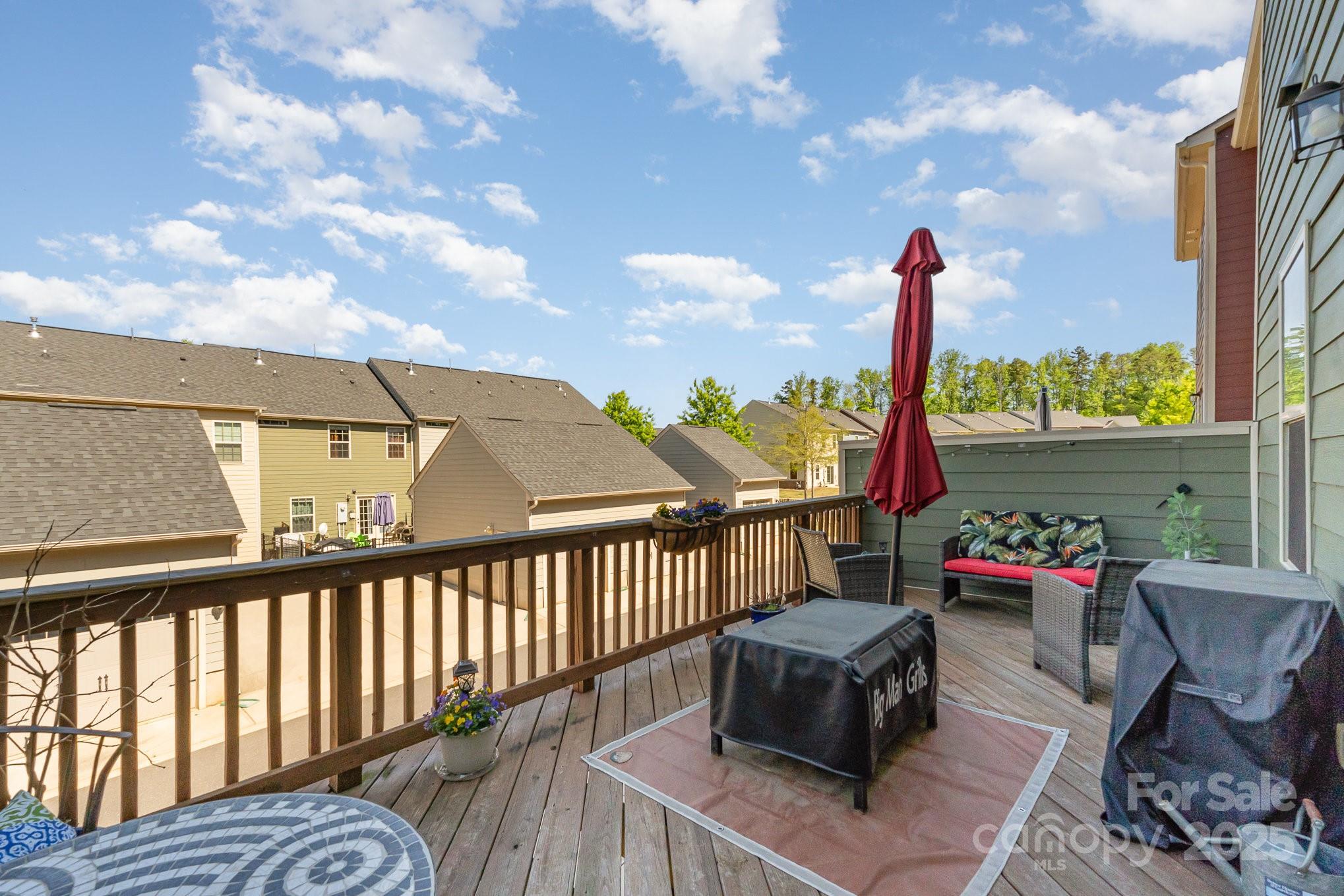 3718 Speer Boulevard Charlotte, NC 28217 - Photo 40 of 48 a roof deck with table and chairs