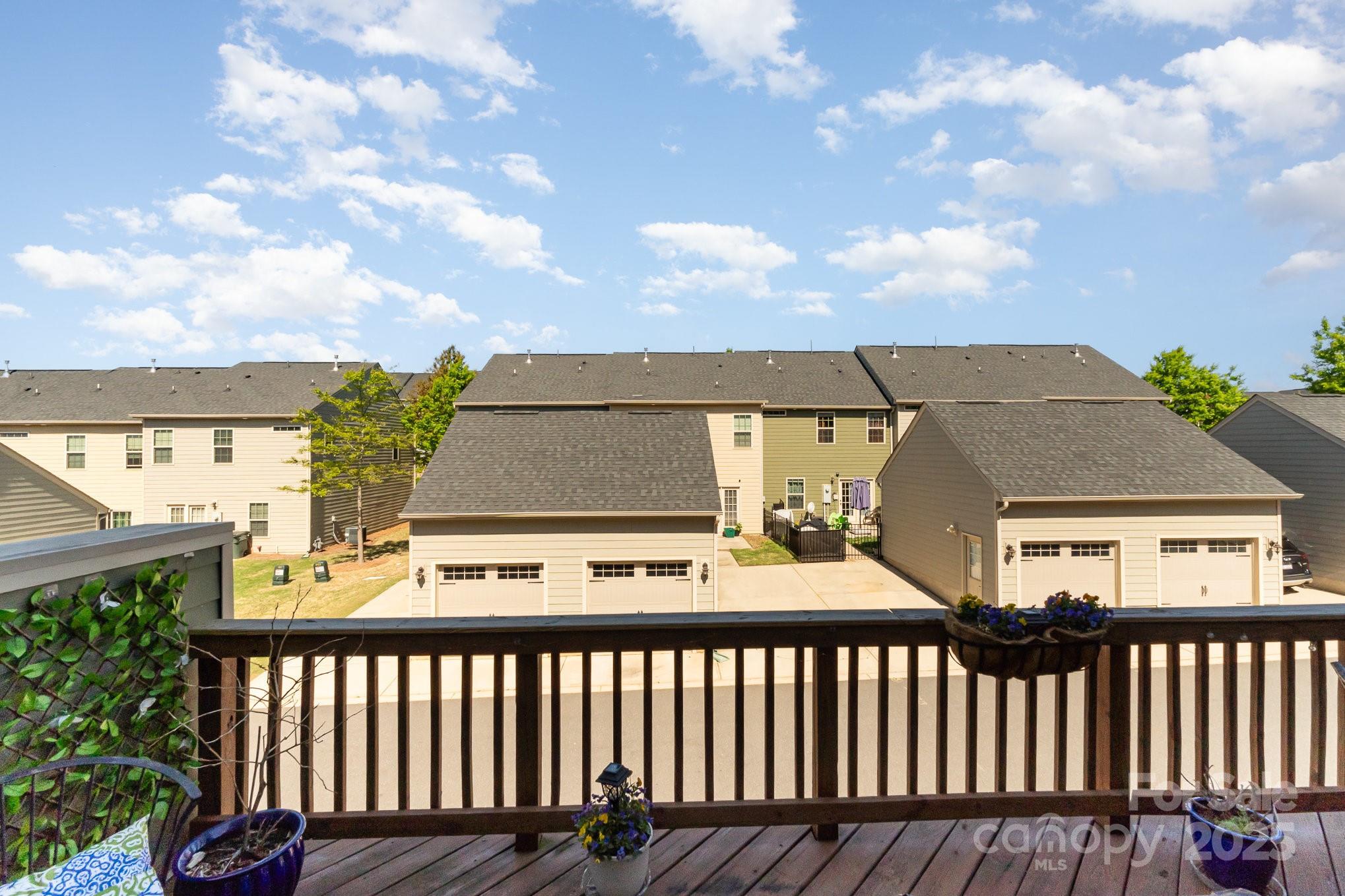 3718 Speer Boulevard Charlotte, NC 28217 - Photo 42 of 48 a roof deck with a table and chairs