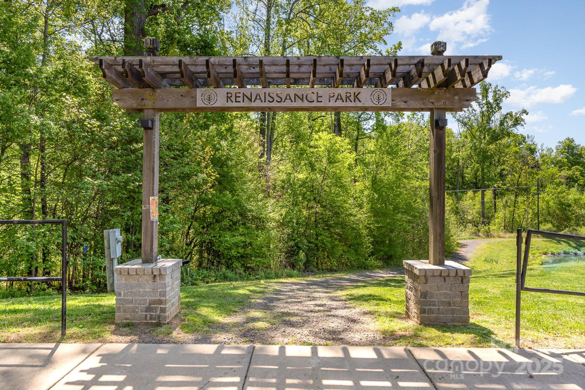 3718 Speer Boulevard Charlotte, NC 28217 - Photo 46 of 48 a view of a patio with table and chairs and wooden fence