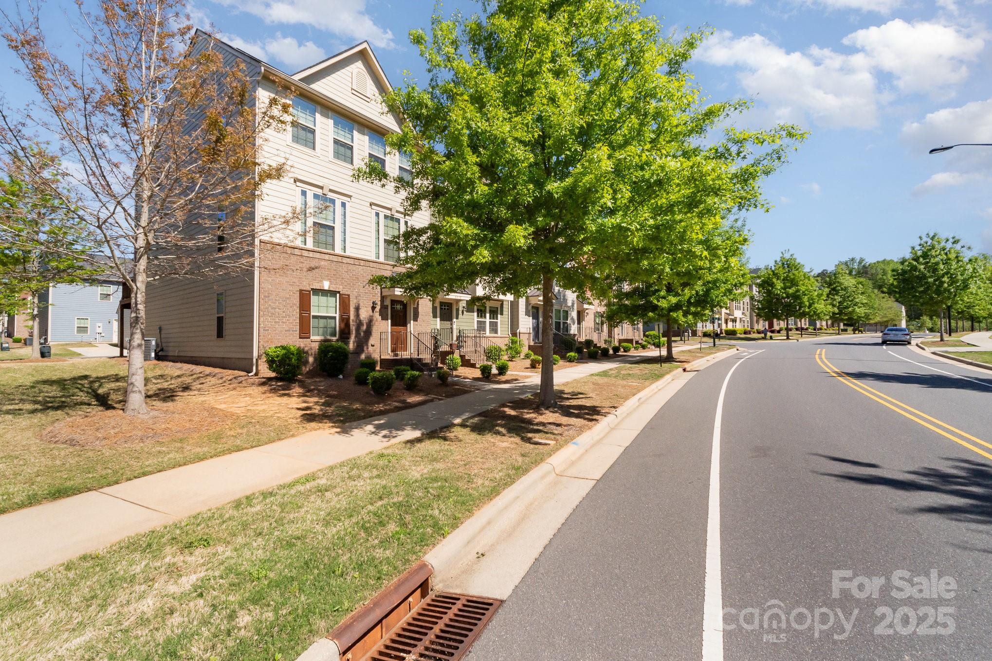 3718 Speer Boulevard Charlotte, NC 28217 - Photo 5 of 48 a view of a house with cars park
