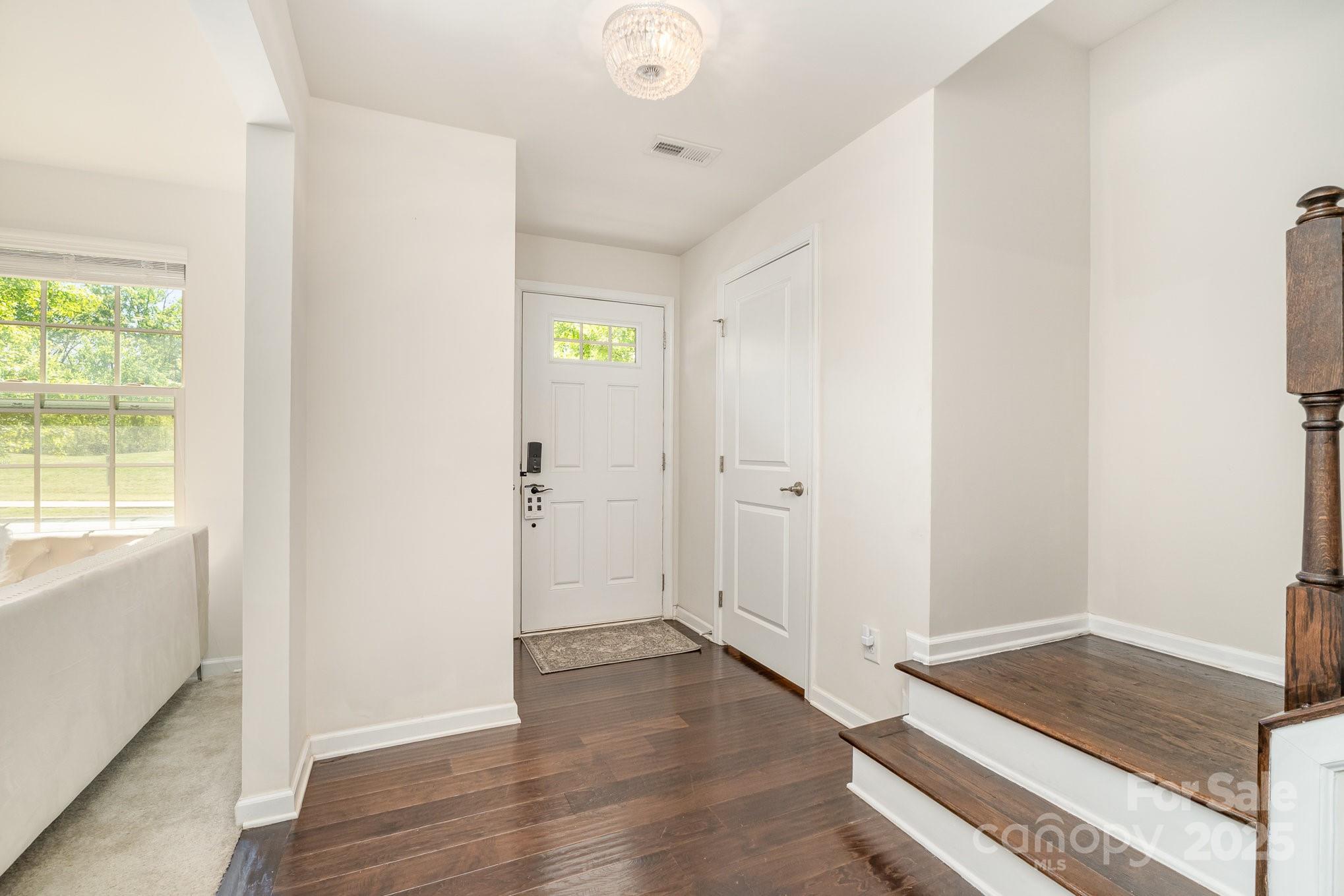 3718 Speer Boulevard Charlotte, NC 28217 - Photo 6 of 48 a view of livingroom with hardwood floor and hallway