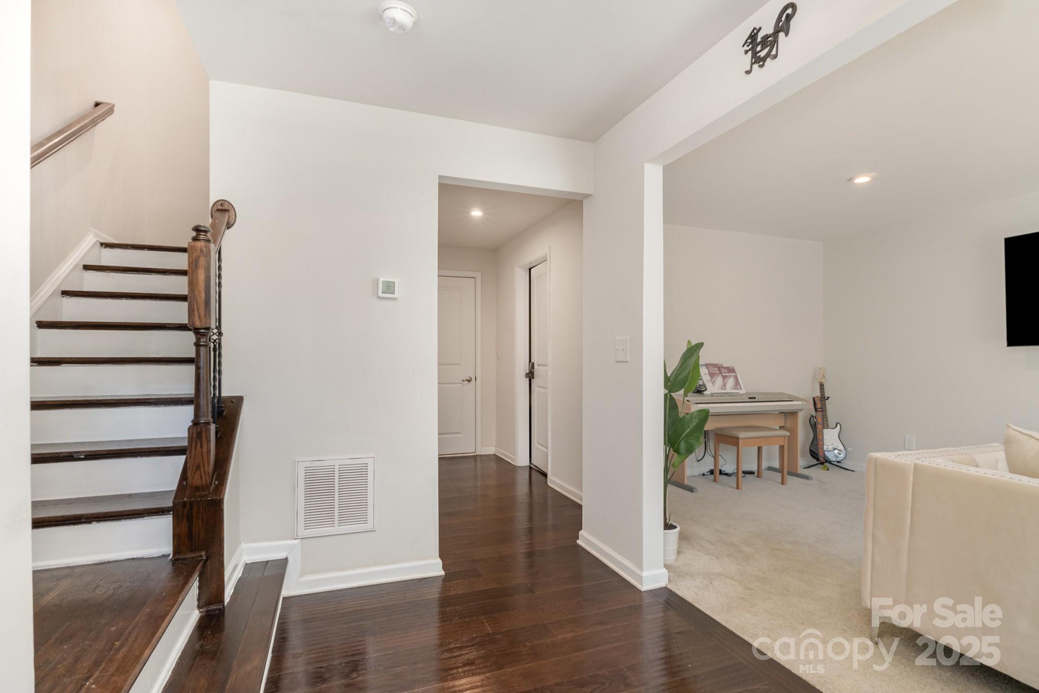 3718 Speer Boulevard Charlotte, NC 28217 - Photo 7 of 48 a view of a room with wooden floor and furniture