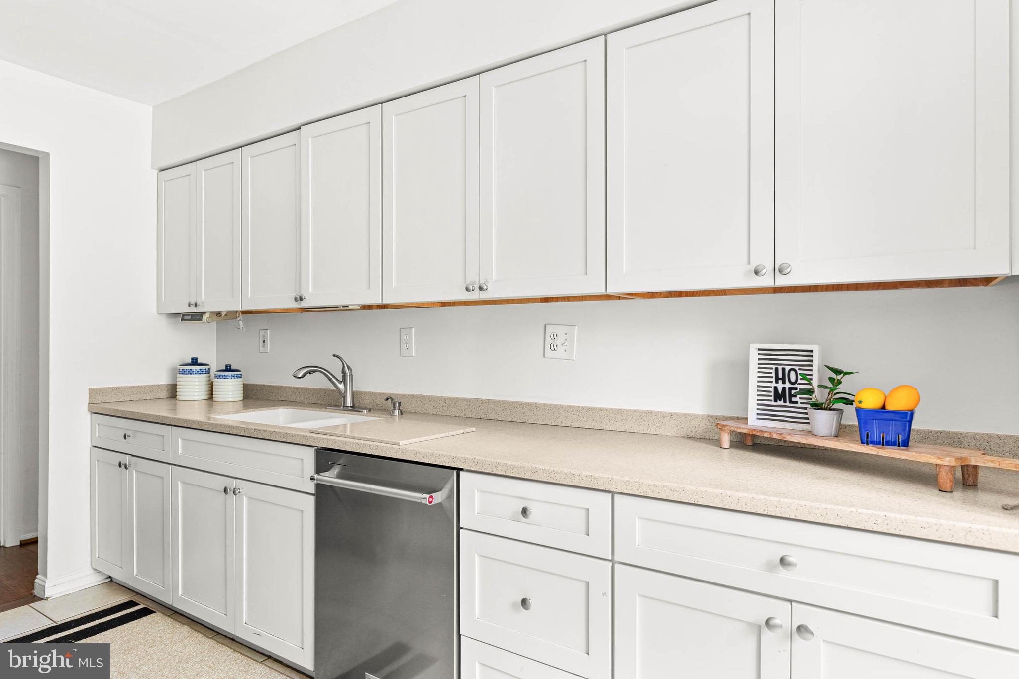 106 Bernard Court Chesterbrook, PA 19087 - Photo 11 of 30 a kitchen with white cabinets and white appliances