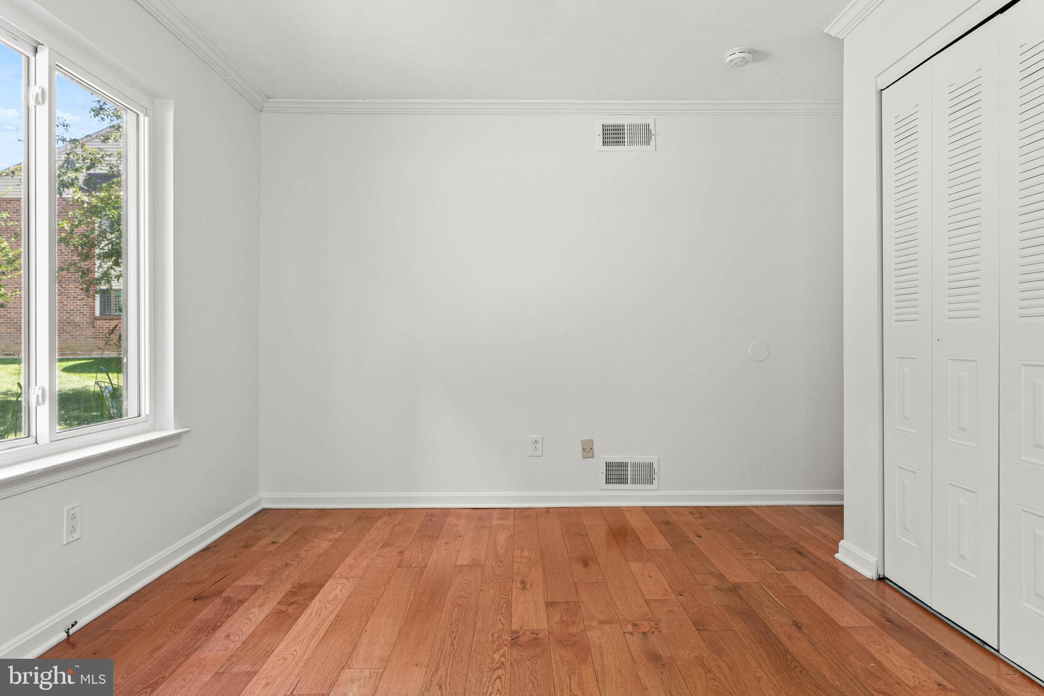 106 Bernard Court Chesterbrook, PA 19087 - Photo 18 of 30 an empty room with a hardwood and a window